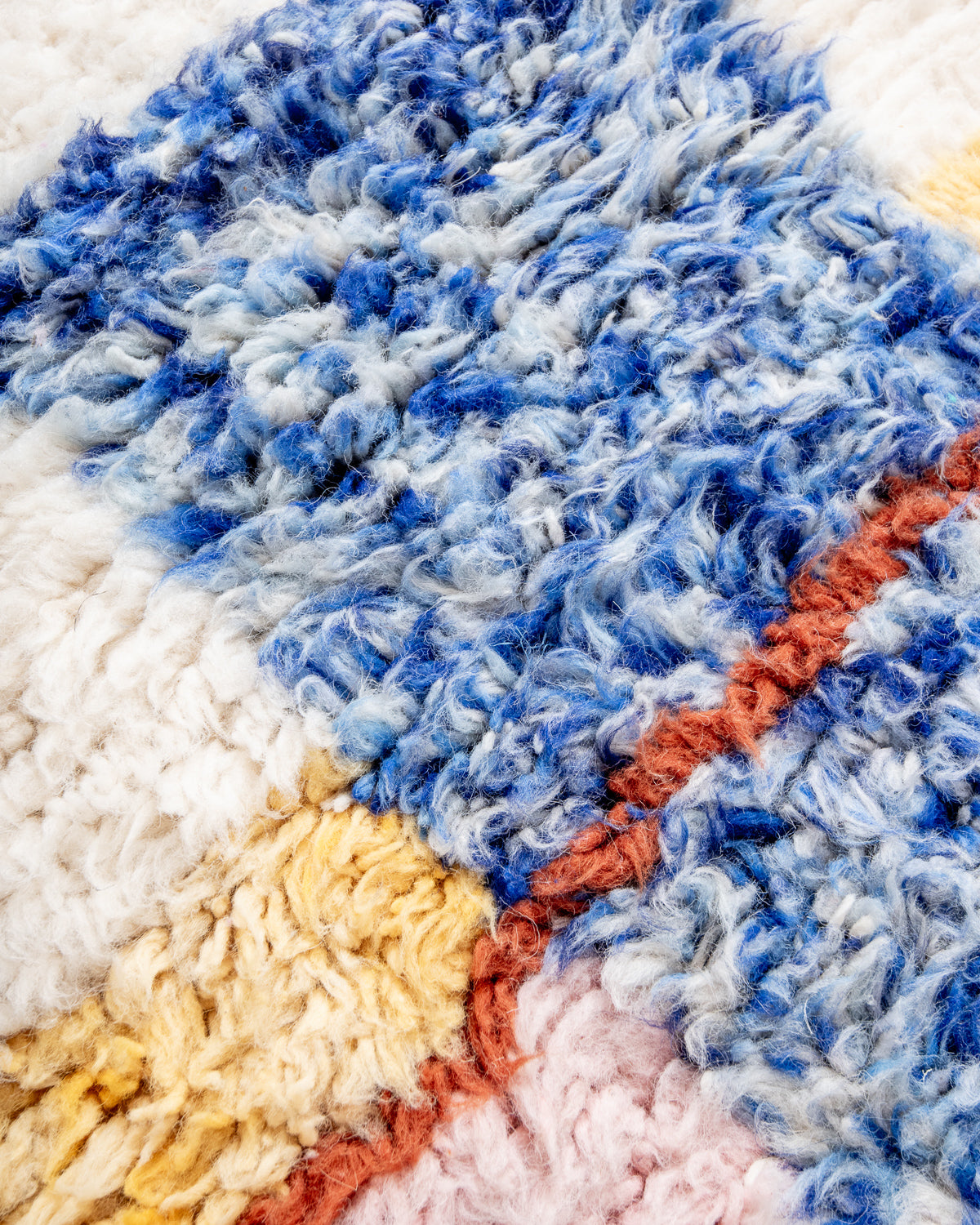 Modern, designer, handcrafted Berber rug from Morocco. Beniourain carpet with beautiful colours and patterns and fluffy wool texture.