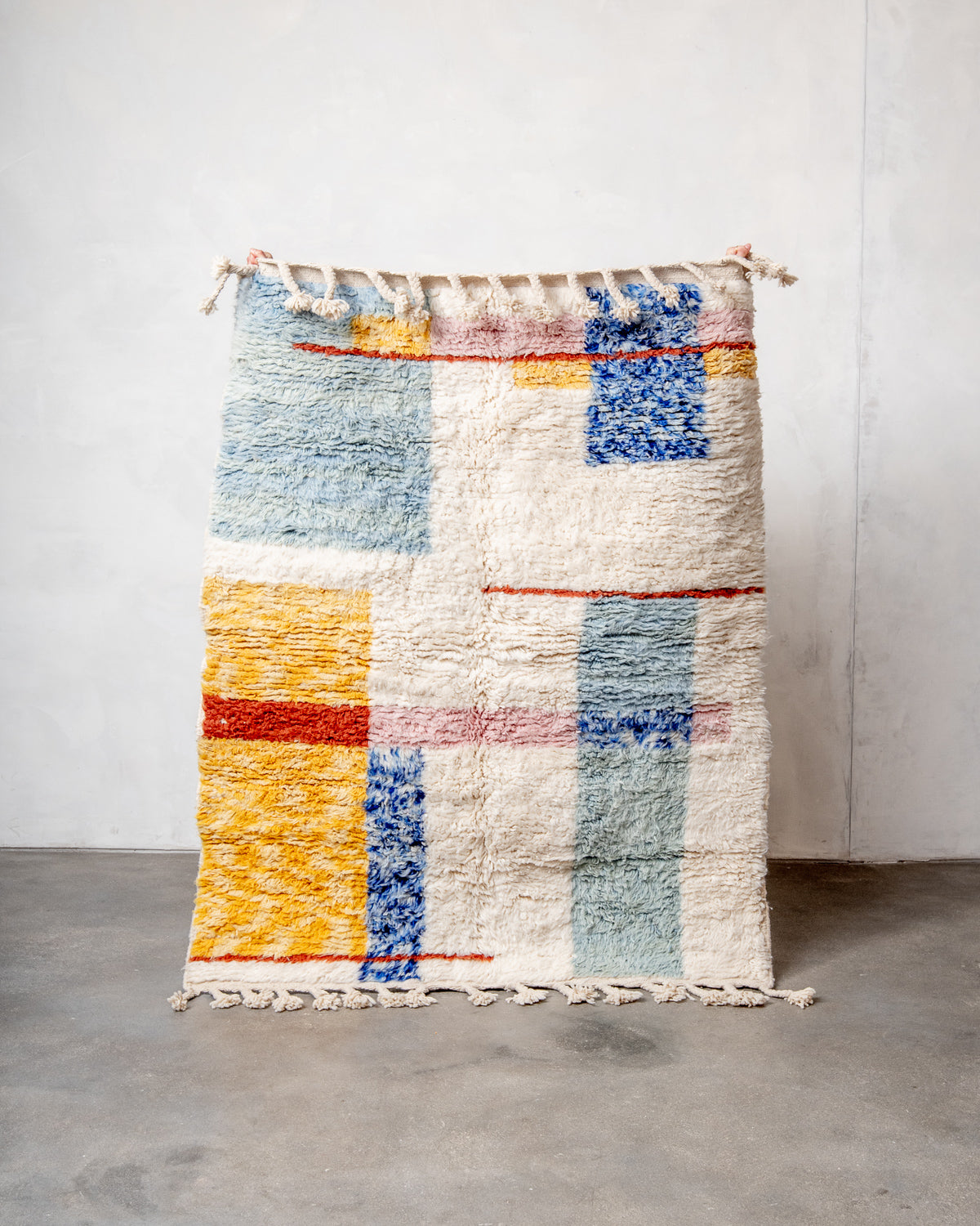 Modern, designer, handcrafted Berber rug from Morocco. Beniourain carpet with beautiful colours and patterns and fluffy wool texture.