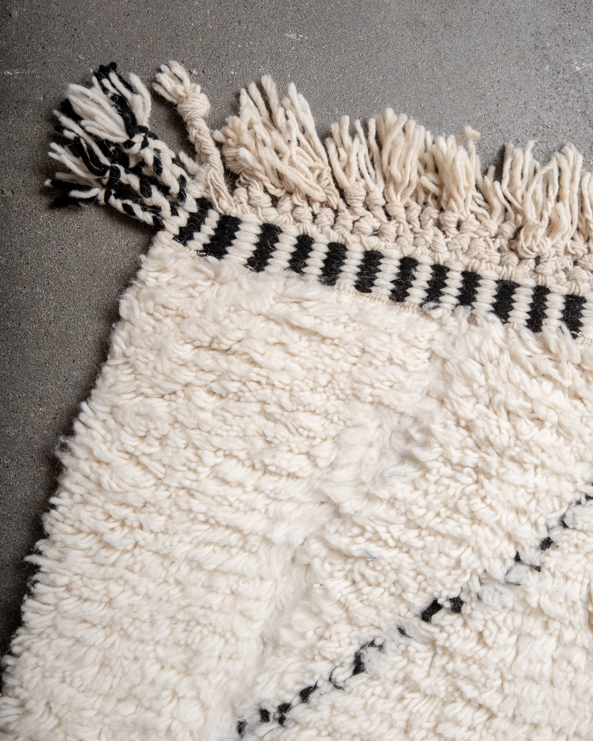 Modern, designer, handcrafted Berber rug from Morocco. Beniourain carpet with minimalist design, natural wool pile and a fluffy texture.