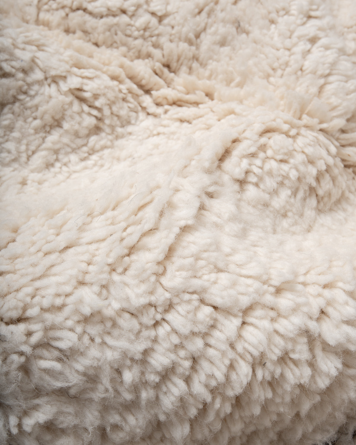 Modern, designer, handcrafted Berber rug from Morocco. Beniourain carpet with minimalist design, natural wool pile and a fluffy texture.