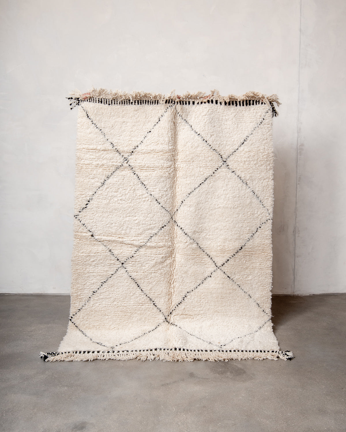Modern, designer, handcrafted Berber rug from Morocco. Beniourain carpet with minimalist design, natural wool pile and a fluffy texture.
