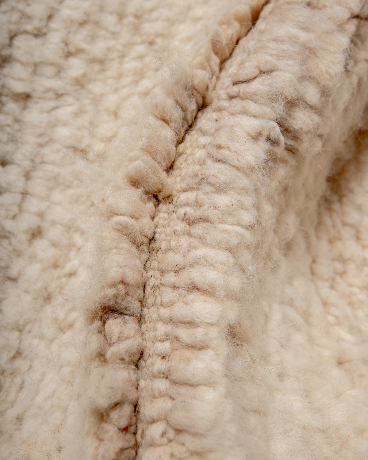 Modern, designer, handcrafted Berber rug from Morocco. Beniourain carpet with minimalist design, natural wool pile and a fluffy texture.