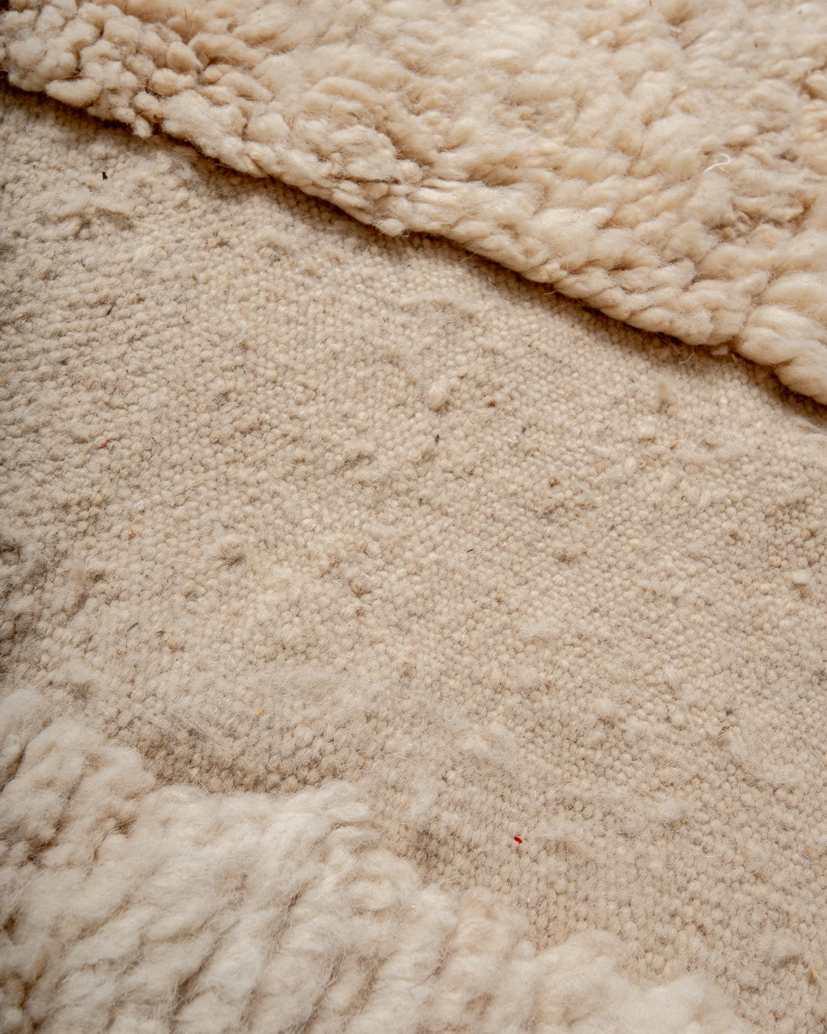 Modern, designer, handcrafted Berber rug from Morocco. Beniourain carpet with minimalist design, natural wool pile and a fluffy texture.