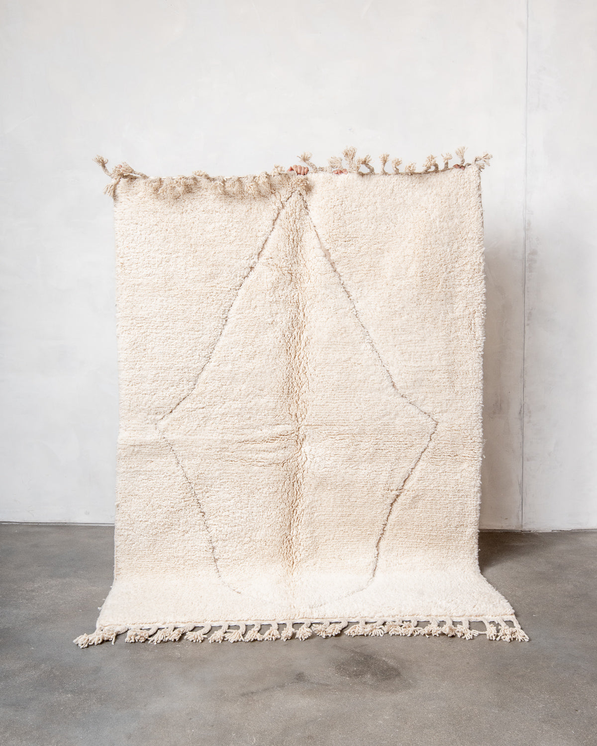 Modern, designer, handcrafted Berber rug from Morocco. Beniourain carpet with minimalist design, natural wool pile and a fluffy texture.