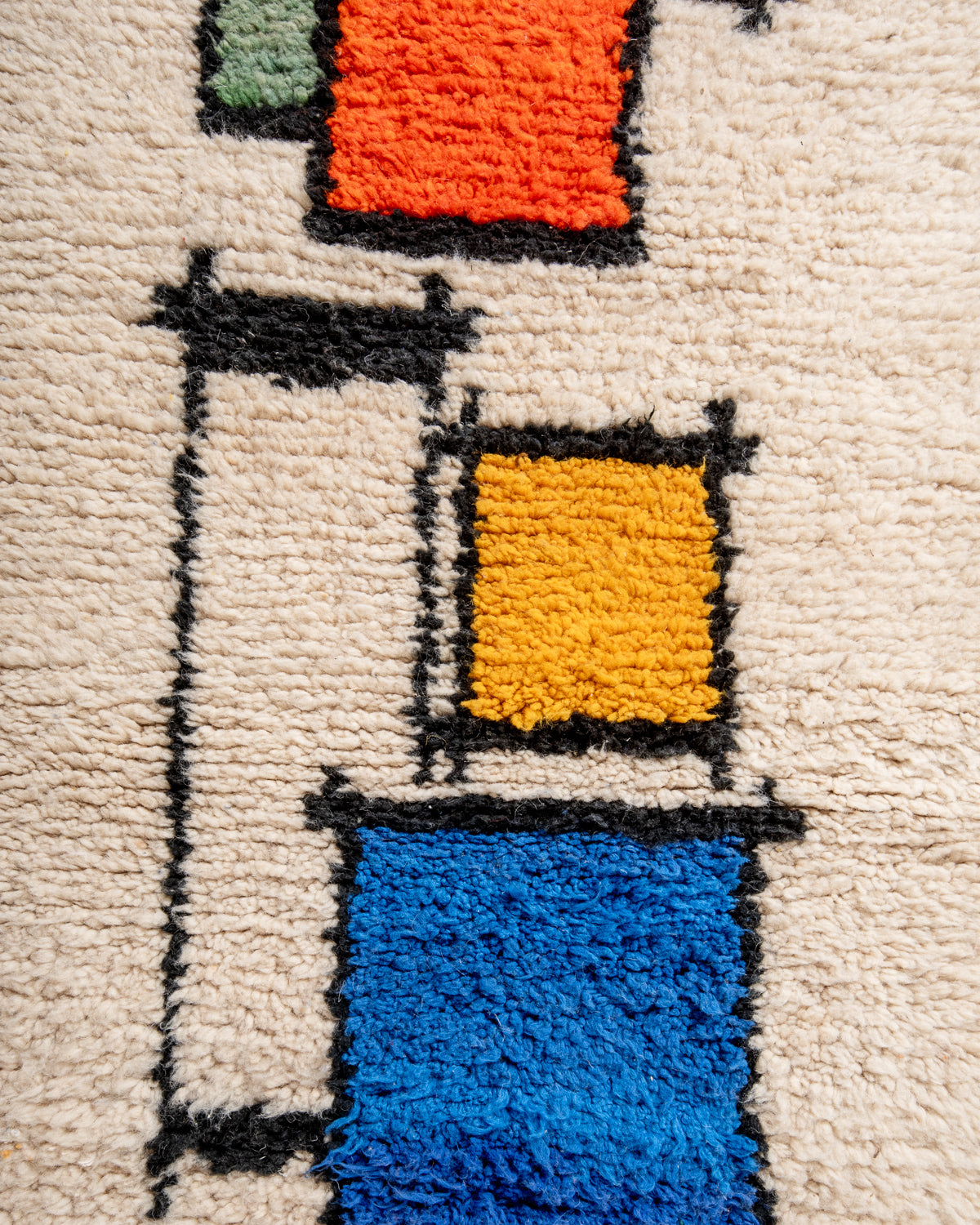 Modern, designer, handcrafted Berber runner rug from Morocco. Beniourain carpet with beautiful colours and patterns and fluffy wool texture.