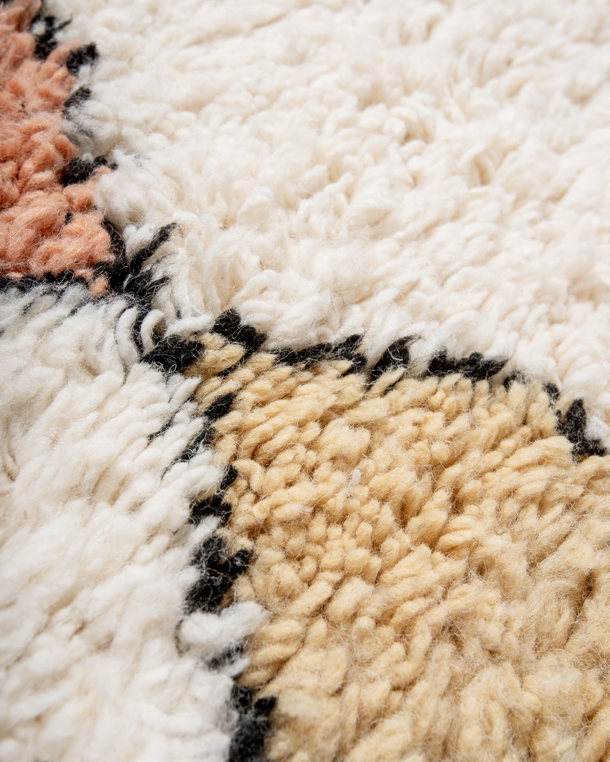Modern, designer, handcrafted Berber runner rug from Morocco. Beniourain carpet with beautiful colours and patterns and fluffy wool texture.