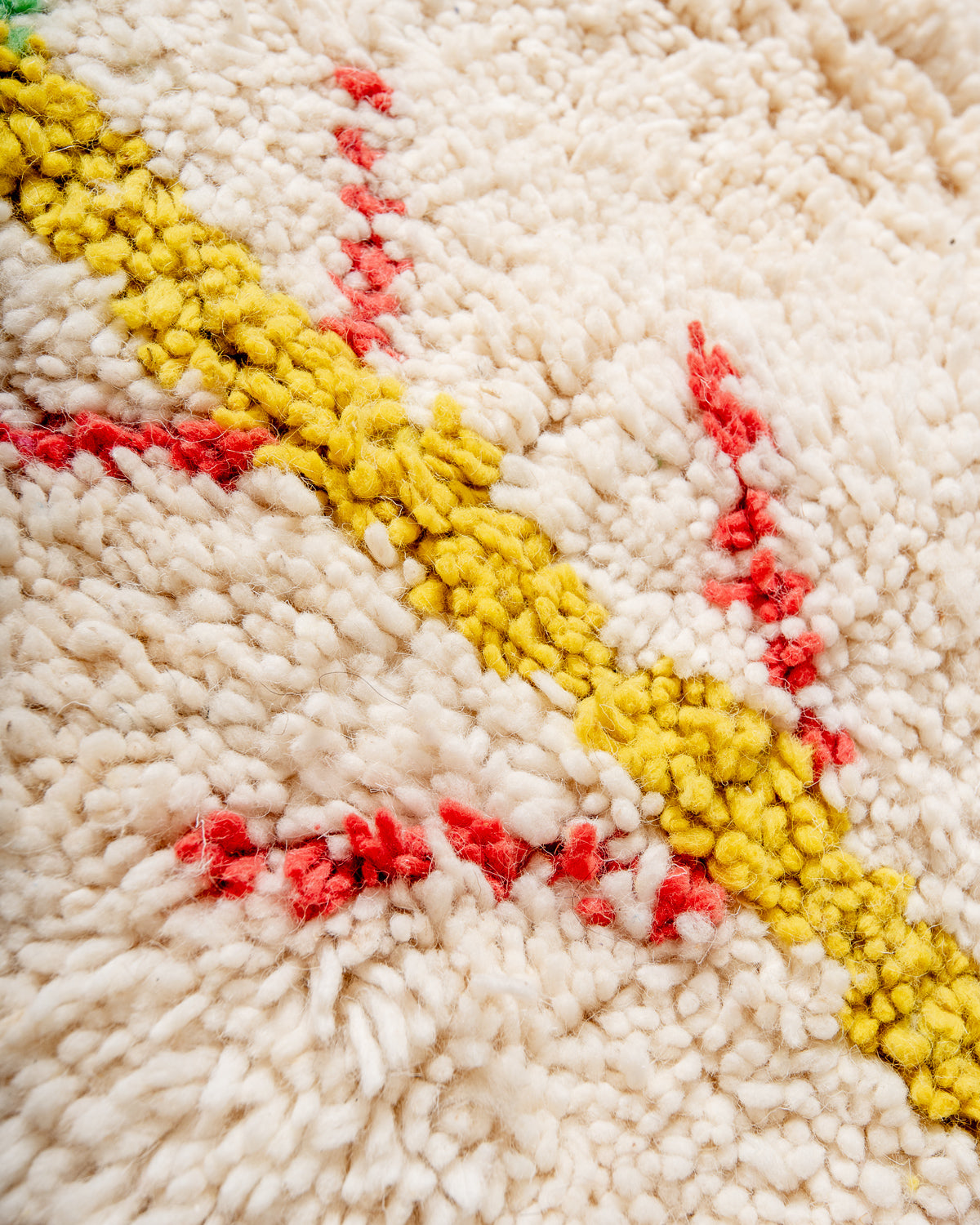 Modern, designer, handcrafted Berber runner rug from Morocco. Beniourain carpet with beautiful colours and patterns and fluffy wool texture.