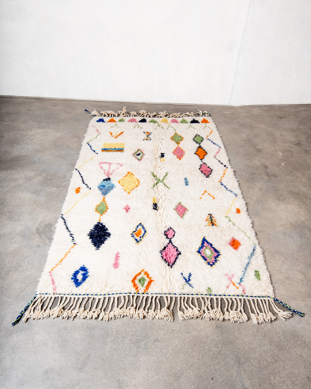 Modern, designer, handcrafted Berber runner rug from Morocco. Beniourain carpet with beautiful colours and patterns and fluffy wool texture.