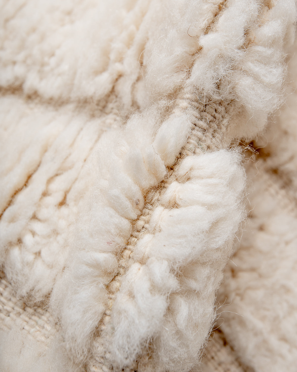 Modern, designer, handcrafted Berber rug from Morocco. Beniourain carpet with minimalist design, natural wool pile and a fluffy texture.