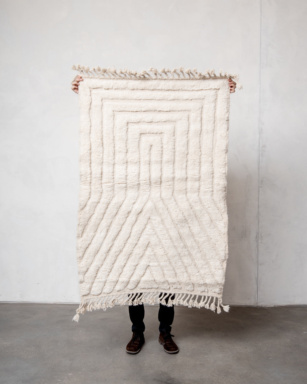 Modern, designer, handcrafted Berber rug from Morocco. Beniourain carpet with minimalist design, natural wool pile and a fluffy texture.