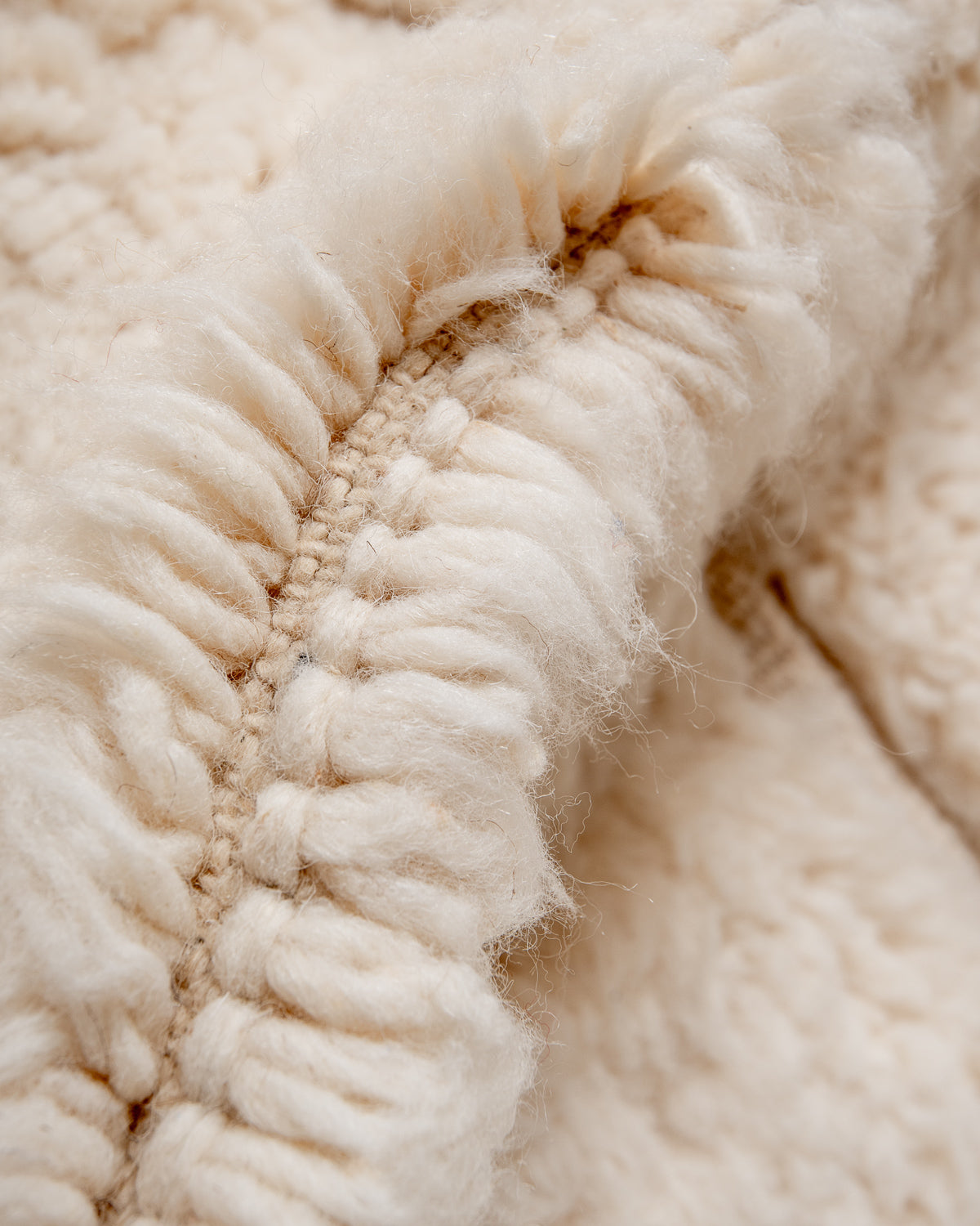 Modern, designer, handcrafted Berber rug from Morocco. Beniourain carpet with minimalist design, natural wool pile and a fluffy texture.