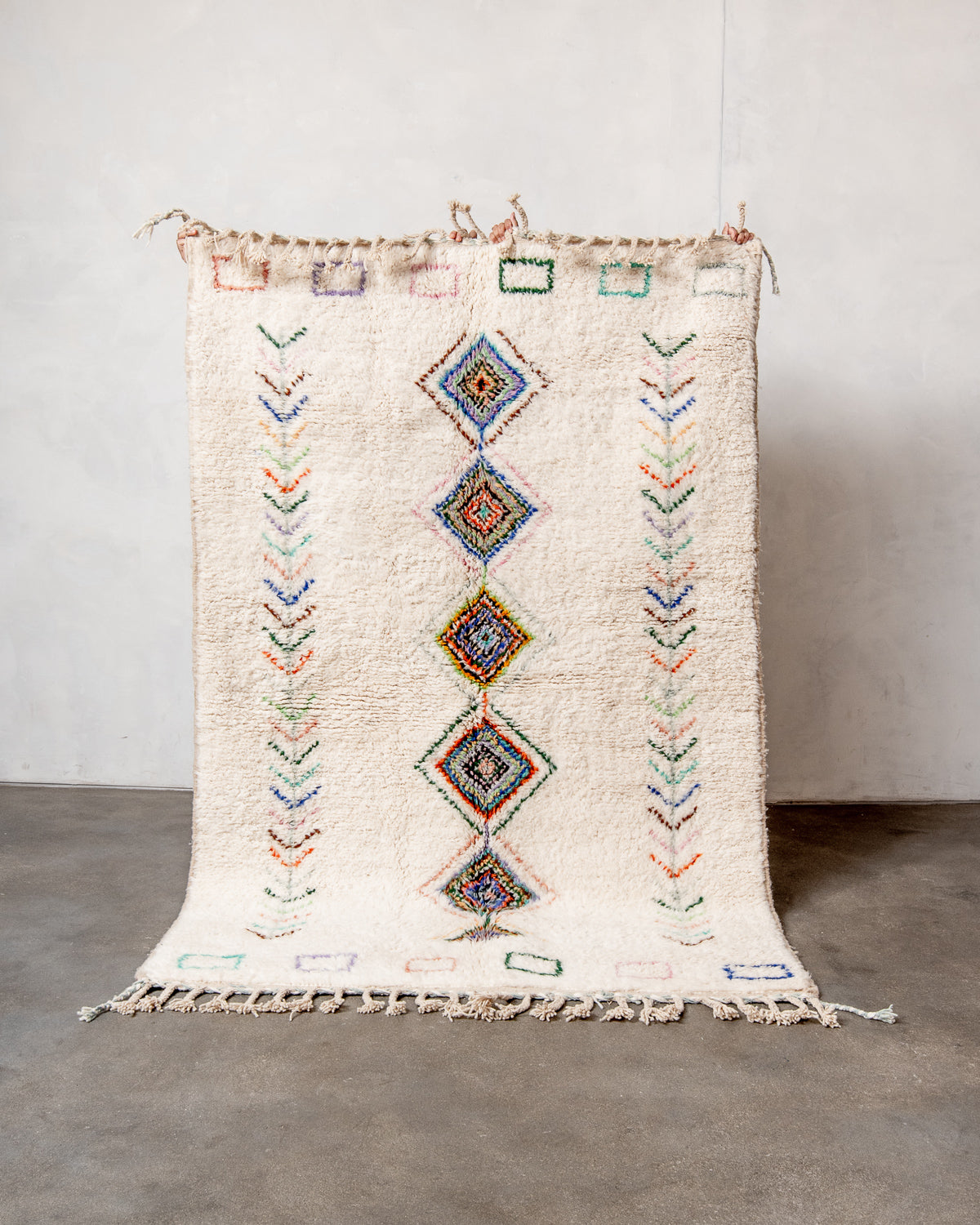 Modern, designer, handcrafted Berber rug from Morocco. Beniourain carpet with beautiful colours and patterns and fluffy wool texture.