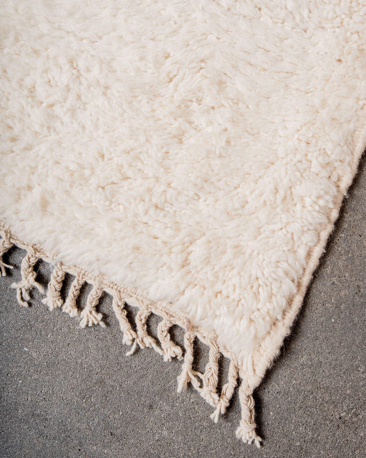 Modern, designer, handcrafted Berber rug from Morocco. Beniourain carpet with minimalist design, natural wool pile and a fluffy texture.