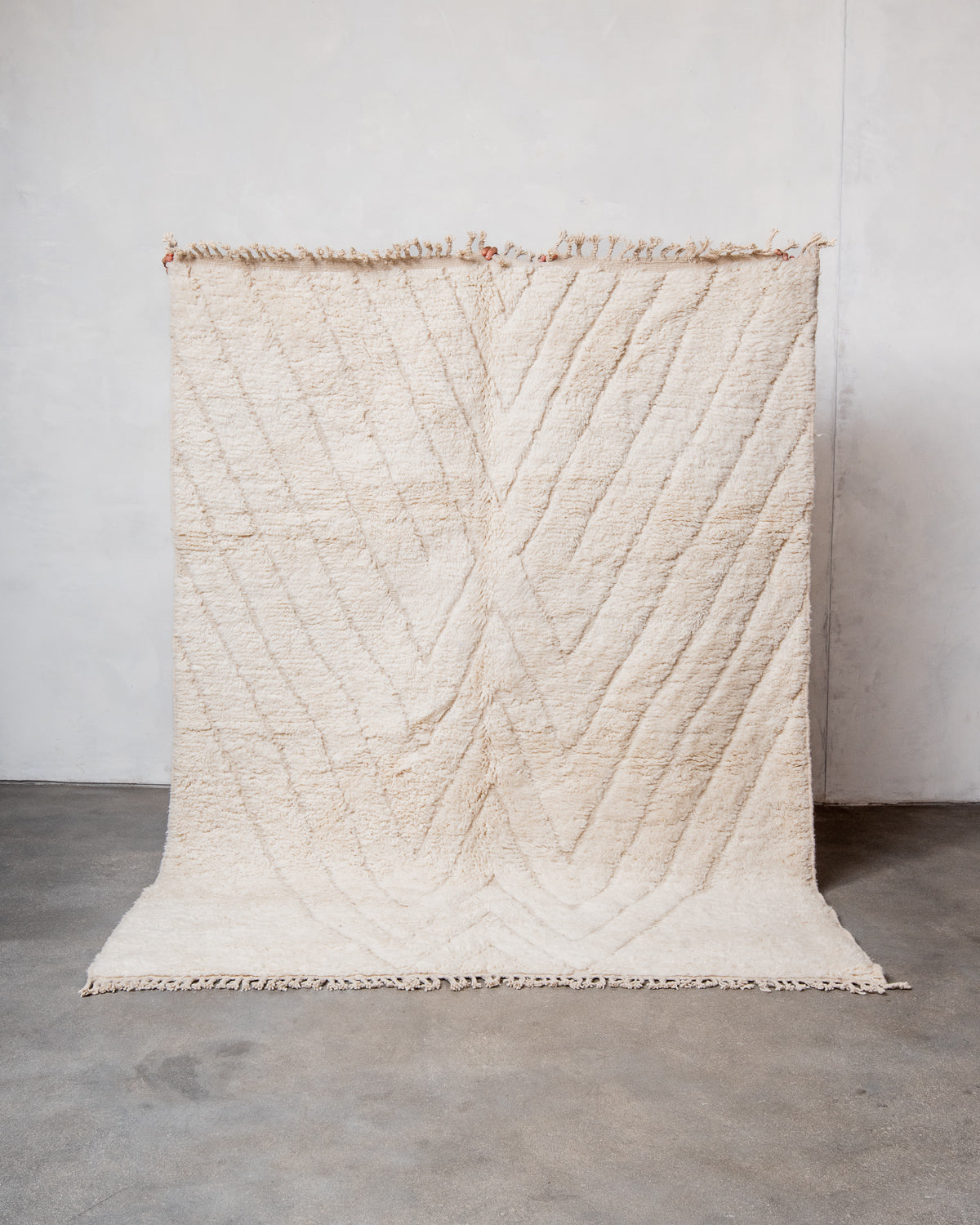 Modern, designer, handcrafted Berber rug from Morocco. Beniourain carpet with minimalist design, natural wool pile and a fluffy texture.