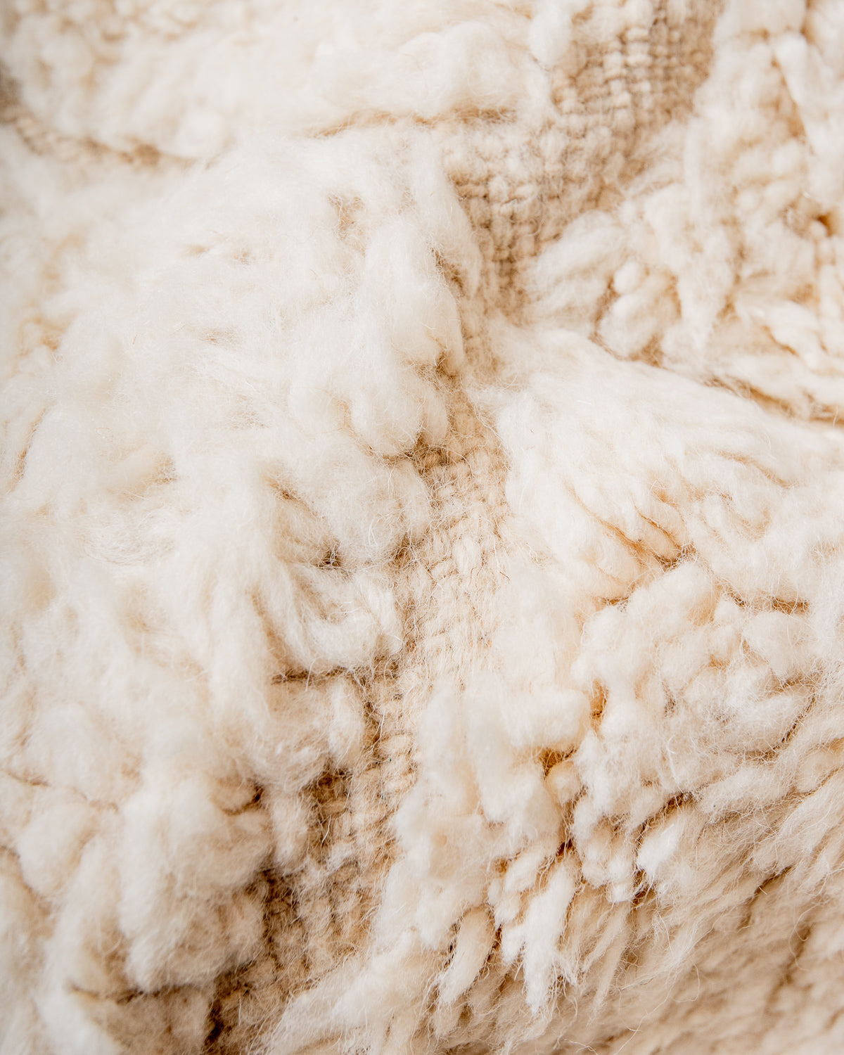 Modern, designer, handcrafted Berber rug from Morocco. Beniourain carpet with minimalist design, natural wool pile and a fluffy texture.