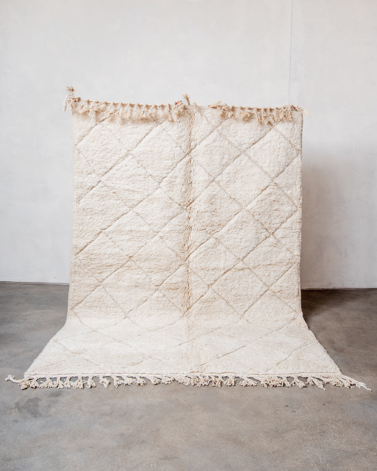 Modern, designer, handcrafted Berber rug from Morocco. Beniourain carpet with minimalist design, natural wool pile and a fluffy texture.