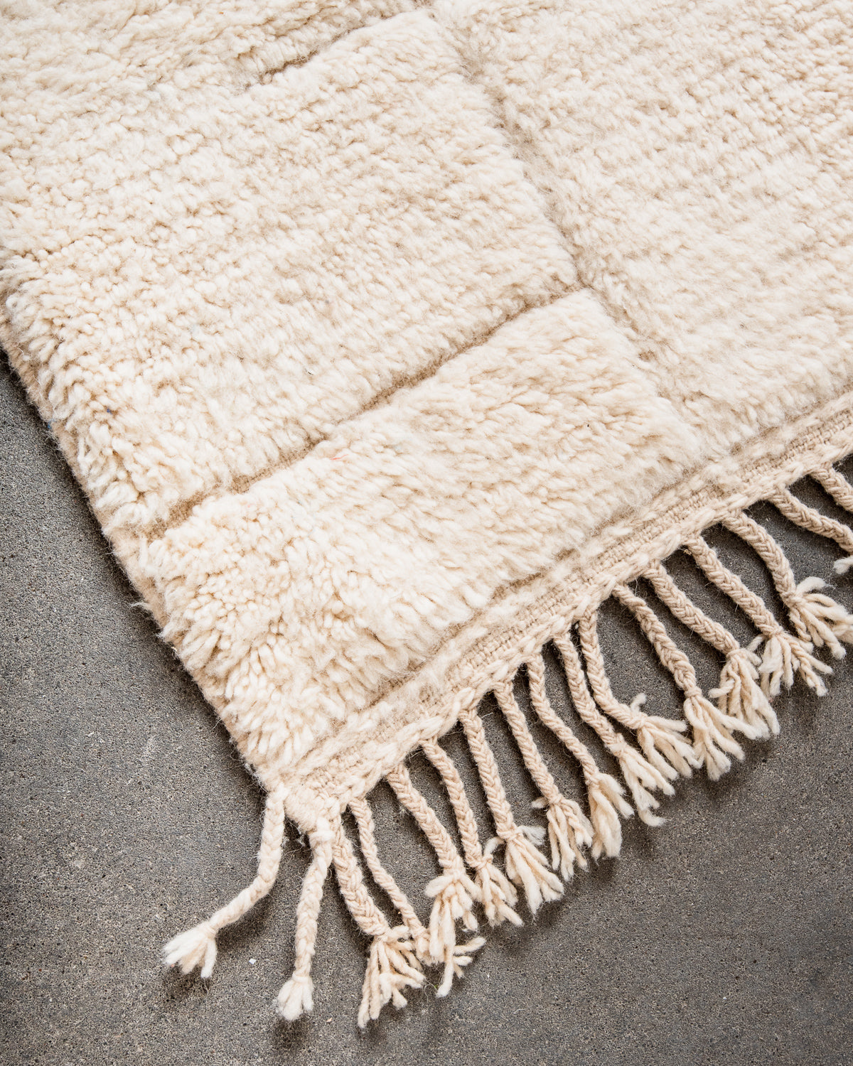 Modern, designer, handcrafted Berber rug from Morocco. Beniourain carpet with minimalist design, natural wool pile and a fluffy texture.