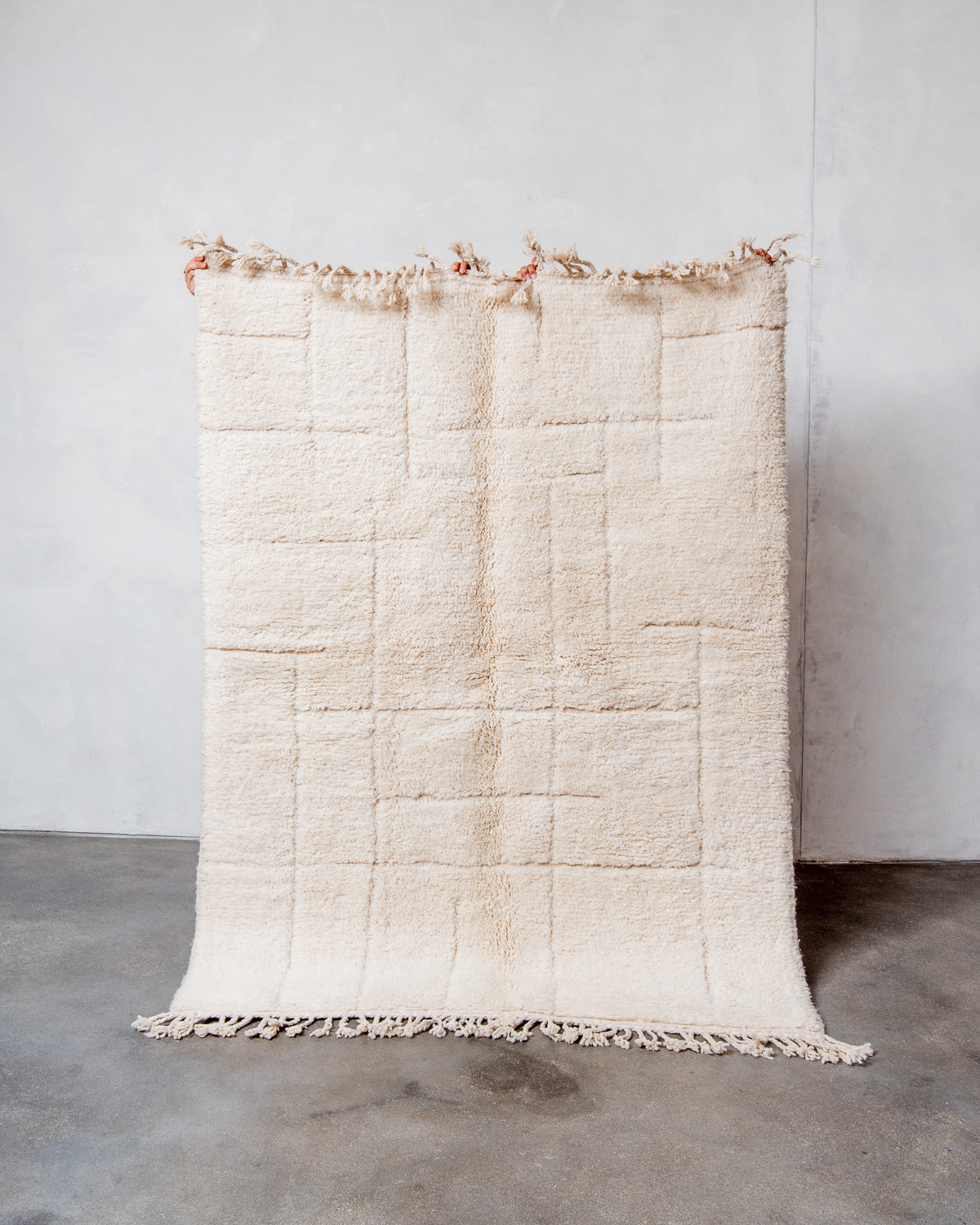 Modern, designer, handcrafted Berber rug from Morocco. Beniourain carpet with minimalist design, natural wool pile and a fluffy texture.