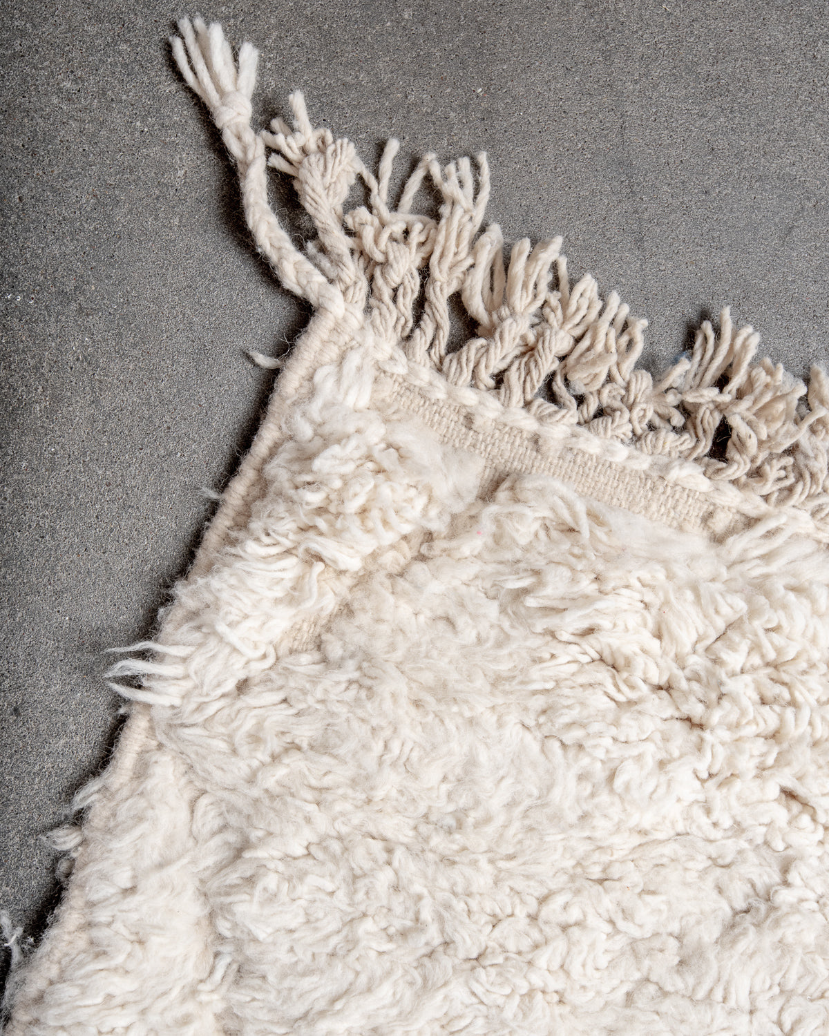 Modern, designer, handcrafted Berber rug from Morocco. Beniourain carpet with minimalist design, natural wool pile and a fluffy texture.