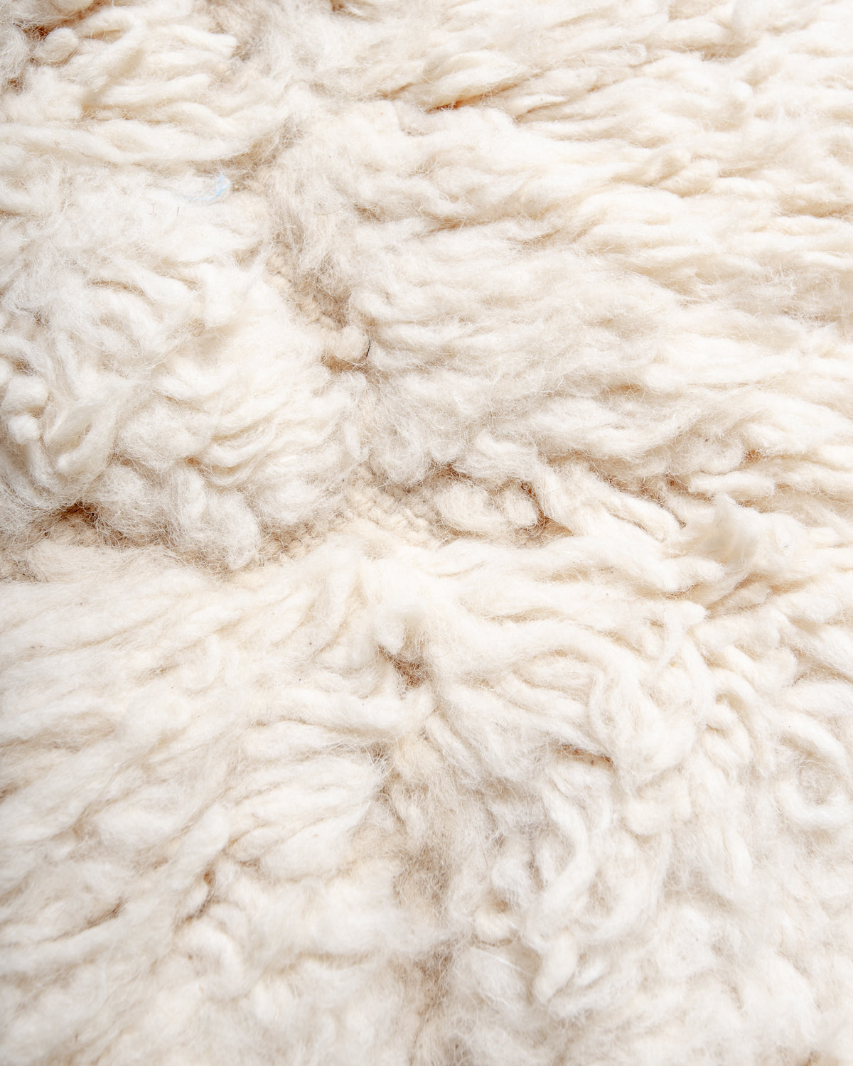 Modern, designer, handcrafted Berber rug from Morocco. Beniourain carpet with minimalist design, natural wool pile and a fluffy texture.