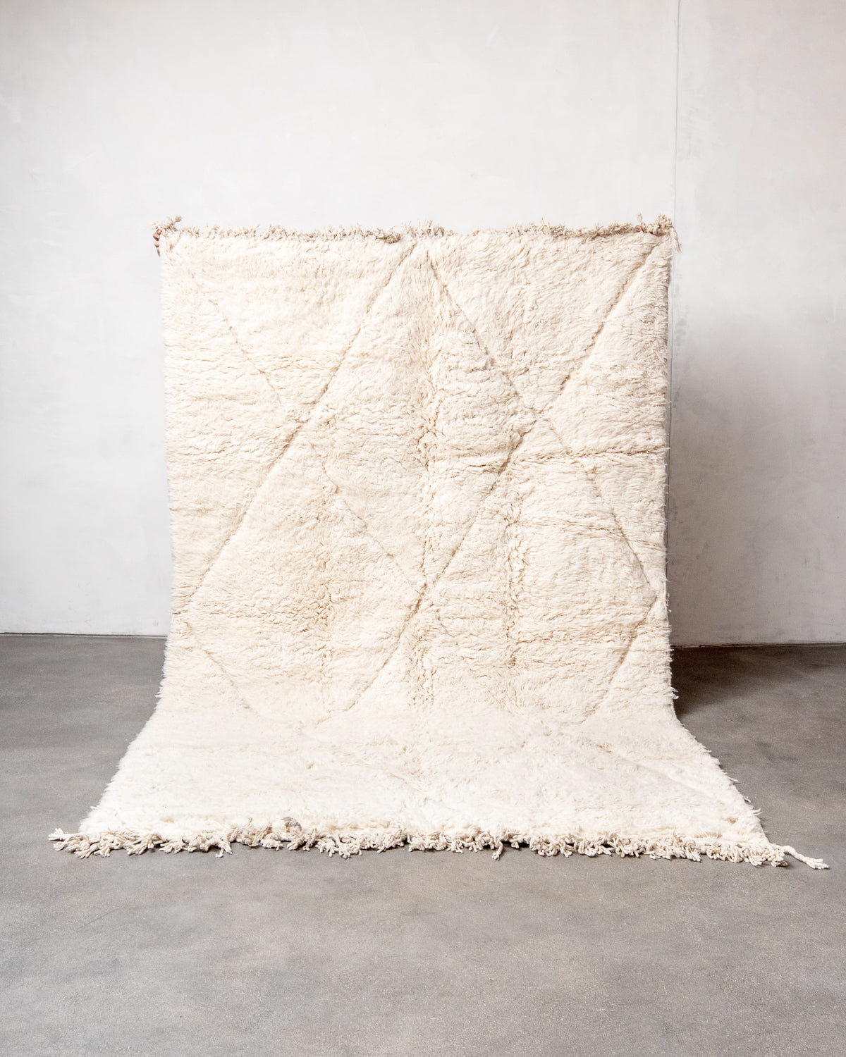 Modern, designer, handcrafted Berber rug from Morocco. Beniourain carpet with minimalist design, natural wool pile and a fluffy texture.