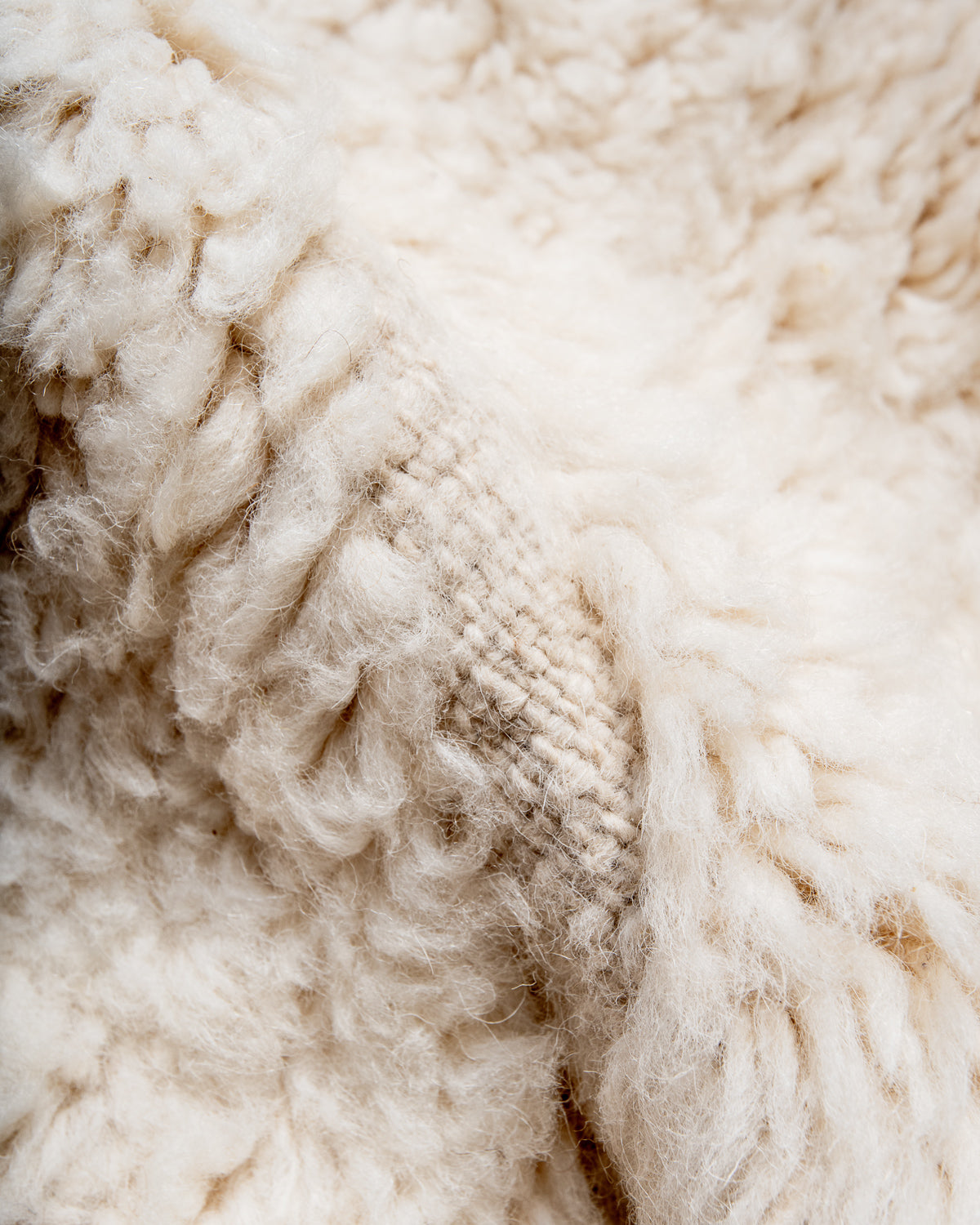 Modern, designer, handcrafted Berber rug from Morocco. Beniourain carpet with minimalist design, natural wool pile and a fluffy texture.