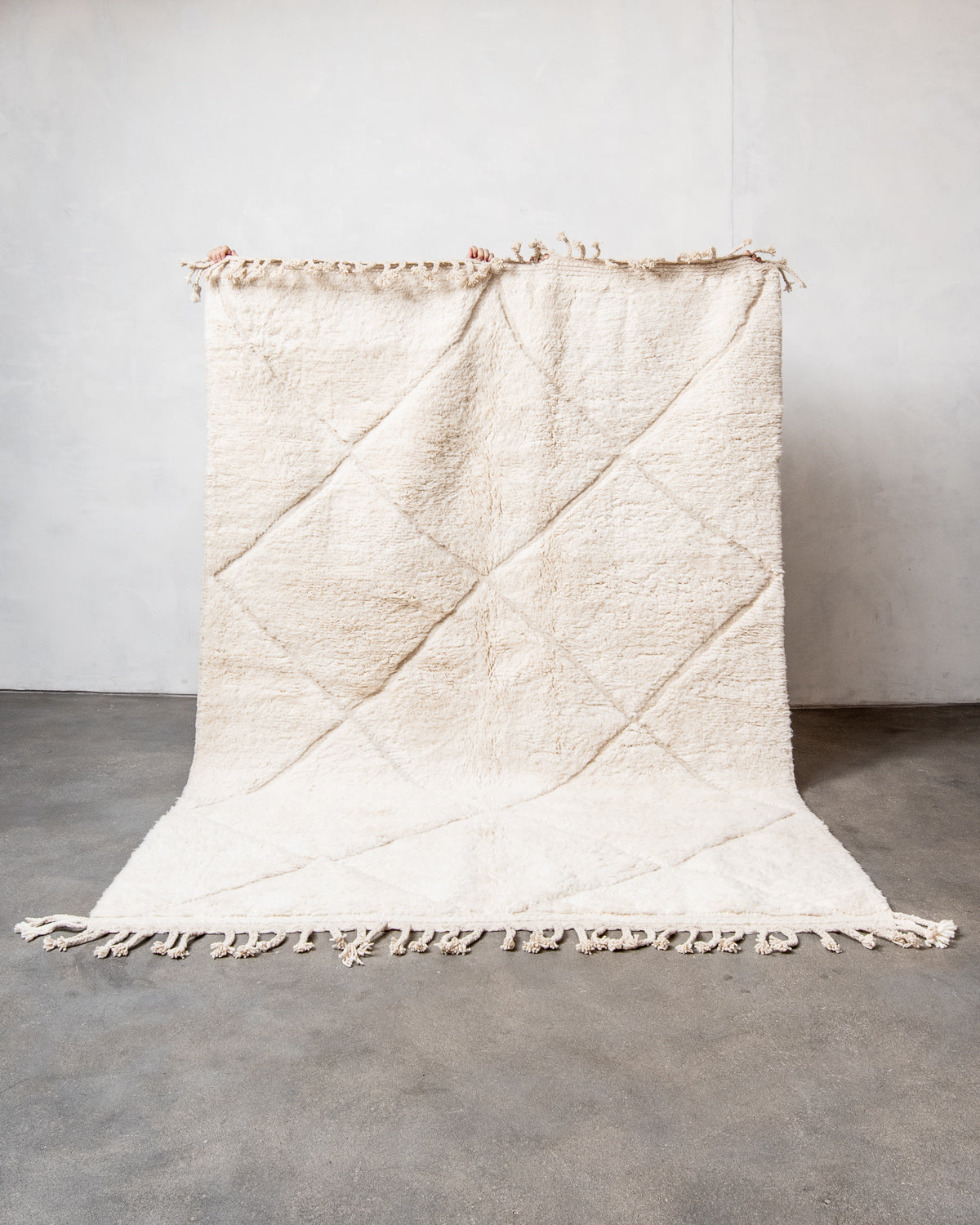 Modern, designer, handcrafted Berber rug from Morocco. Beniourain carpet with minimalist design, natural wool pile and a fluffy texture.