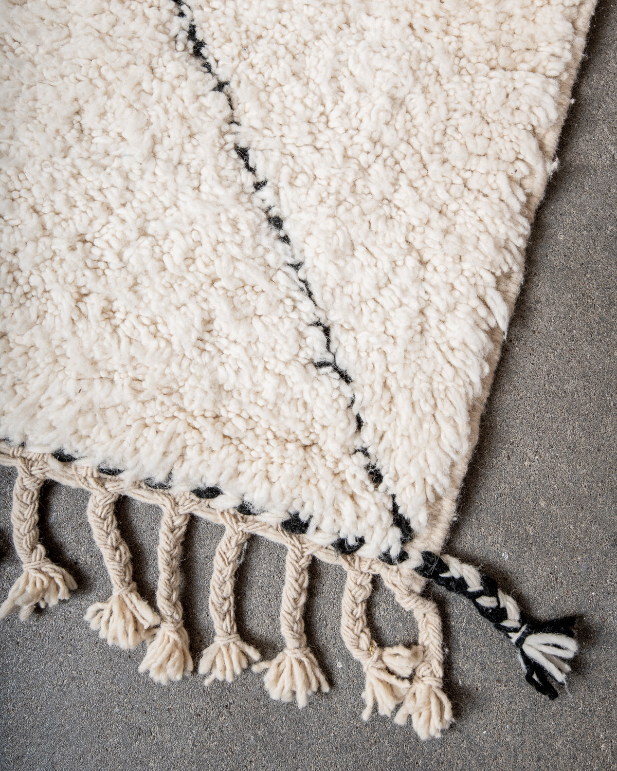 Modern, designer, handcrafted Berber rug from Morocco. Beniourain carpet with minimalist design, natural wool pile and a fluffy texture.