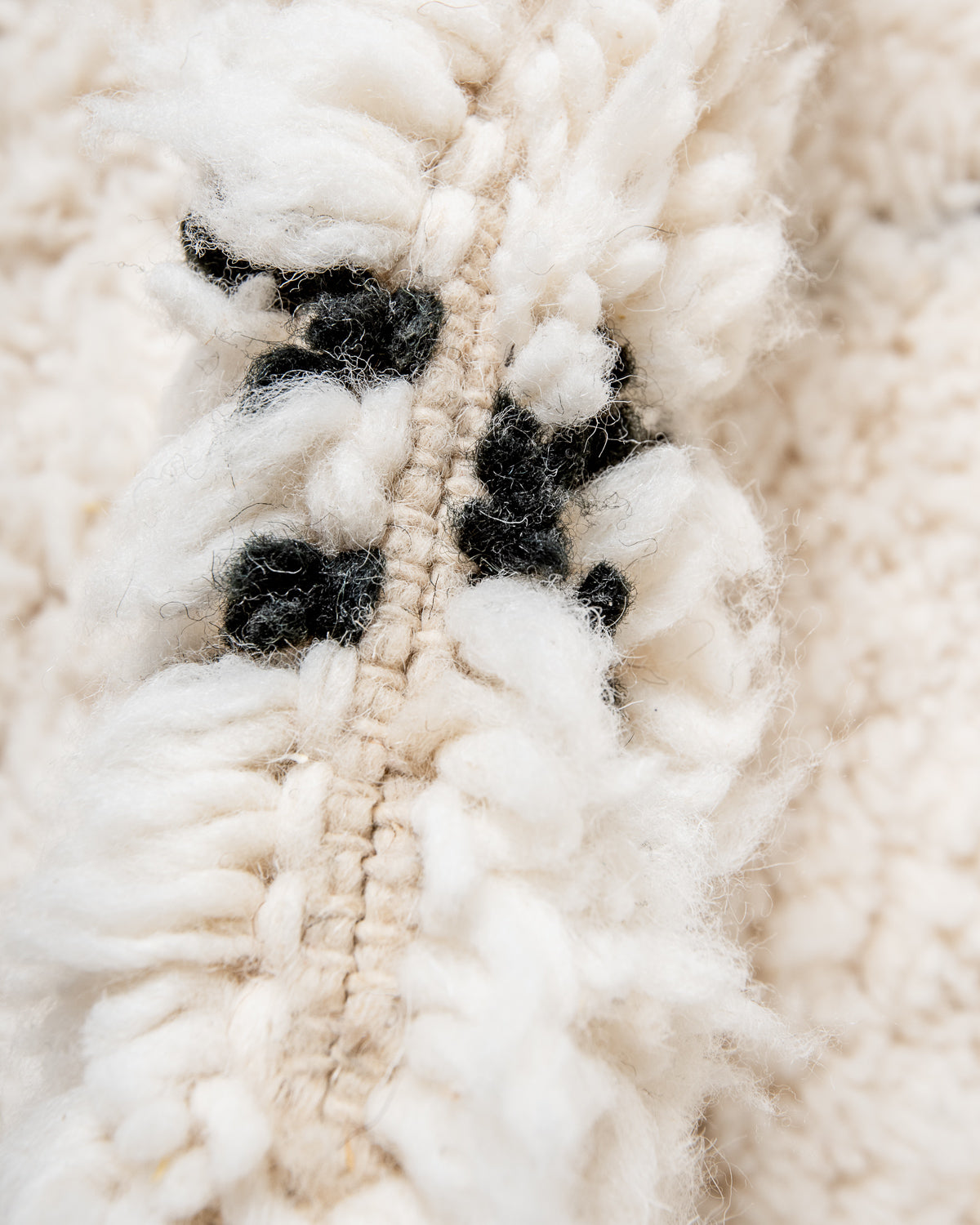 Modern, designer, handcrafted Berber rug from Morocco. Beniourain carpet with minimalist design, natural wool pile and a fluffy texture.