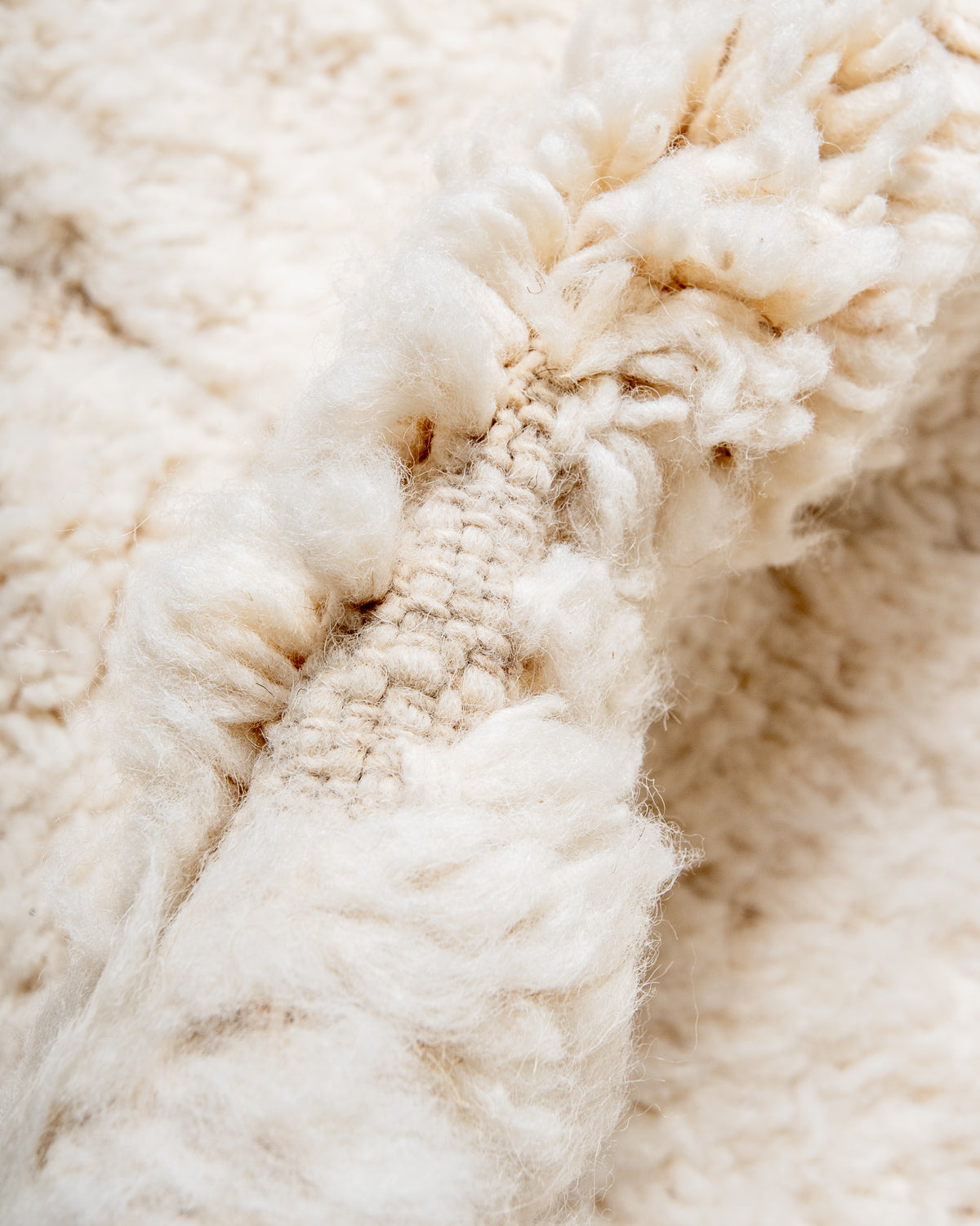 Modern, designer, handcrafted Berber rug from Morocco. Beniourain carpet with minimalist design, natural wool pile and a fluffy texture.