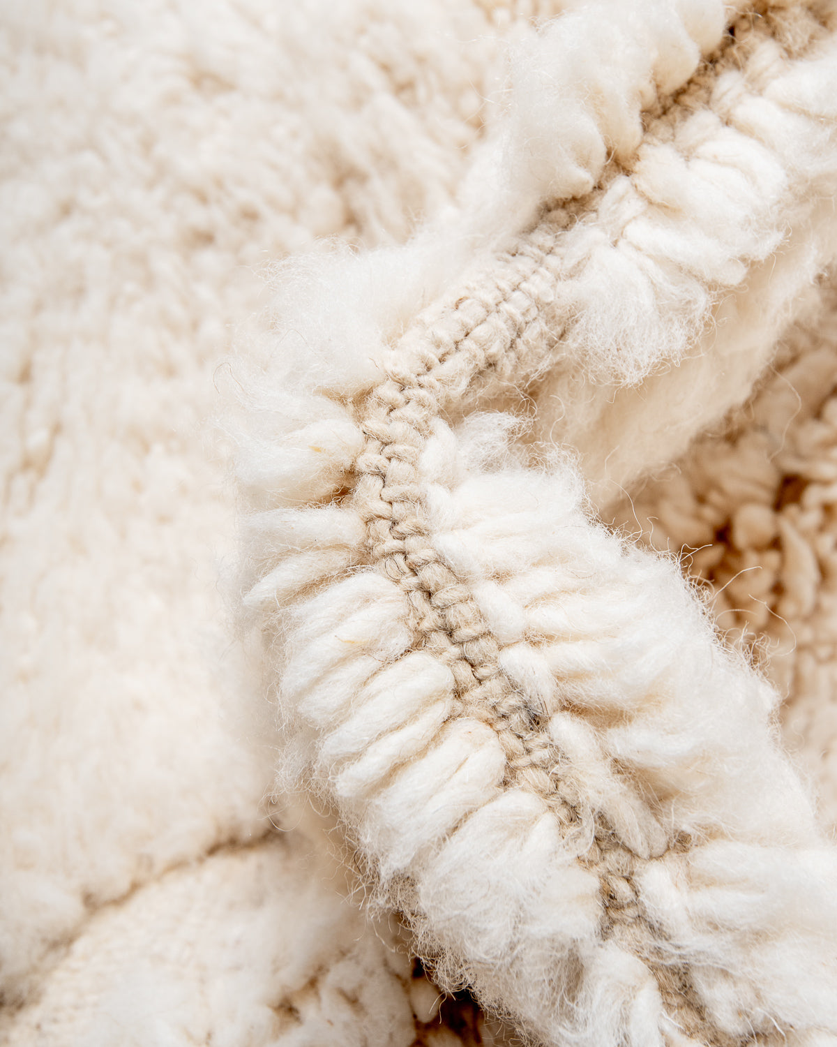 Modern, designer, handcrafted Berber rug from Morocco. Beniourain carpet with minimalist design, natural wool pile and a fluffy texture.