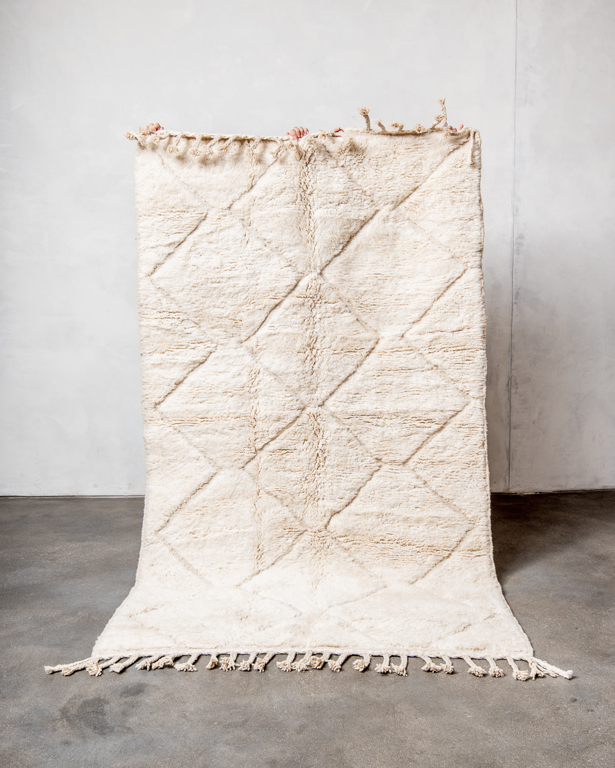 Modern, designer, handcrafted Berber rug from Morocco. Beniourain carpet with minimalist design, natural wool pile and a fluffy texture.