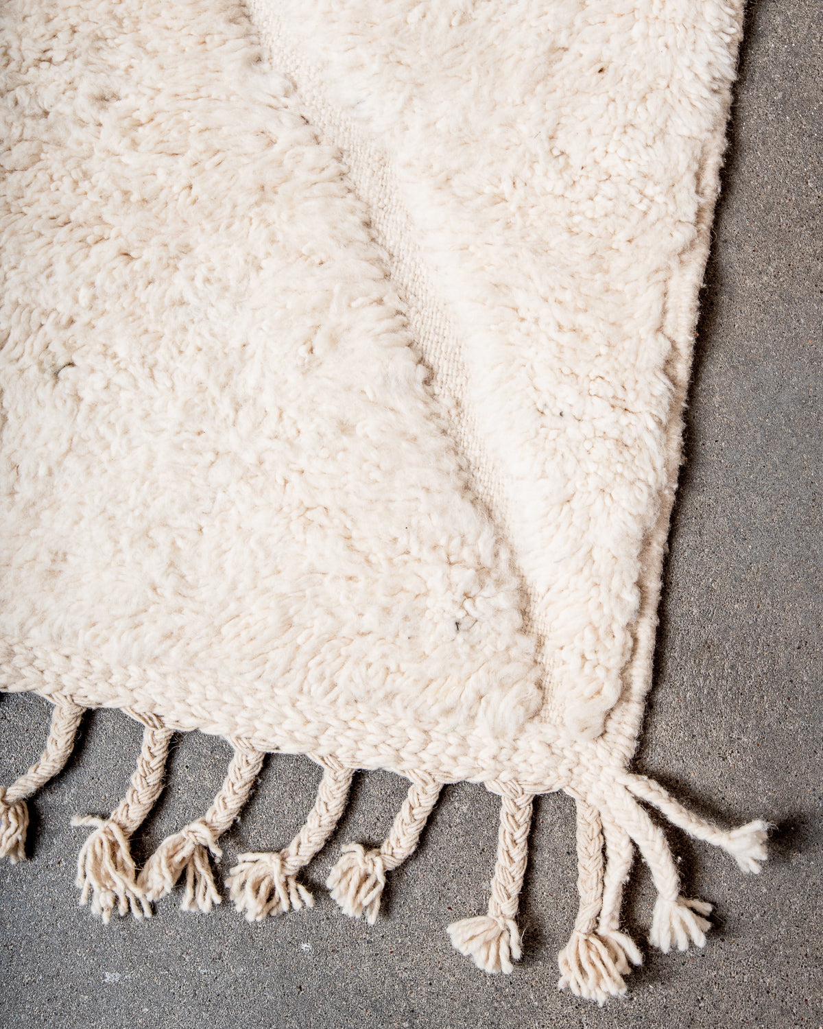 Modern, designer, handcrafted Berber rug from Morocco. Beniourain carpet with minimalist design, natural wool pile and a fluffy texture.