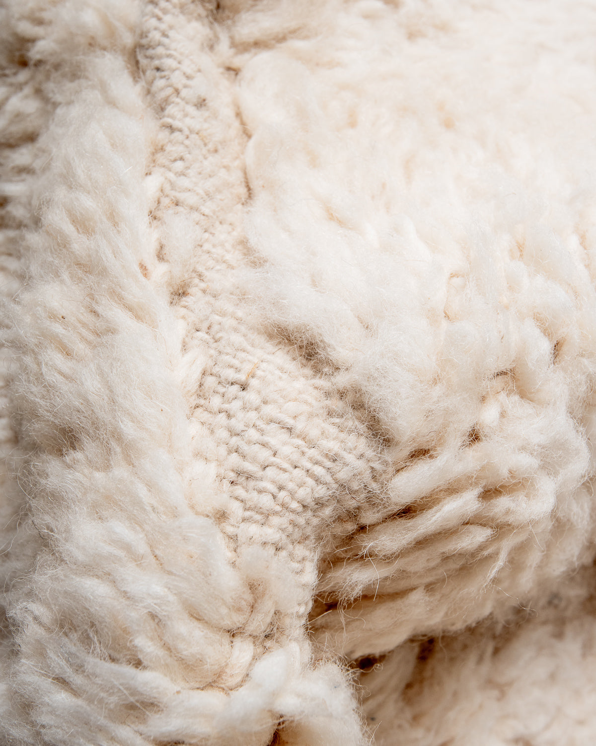 Modern, designer, handcrafted Berber rug from Morocco. Beniourain carpet with minimalist design, natural wool pile and a fluffy texture.