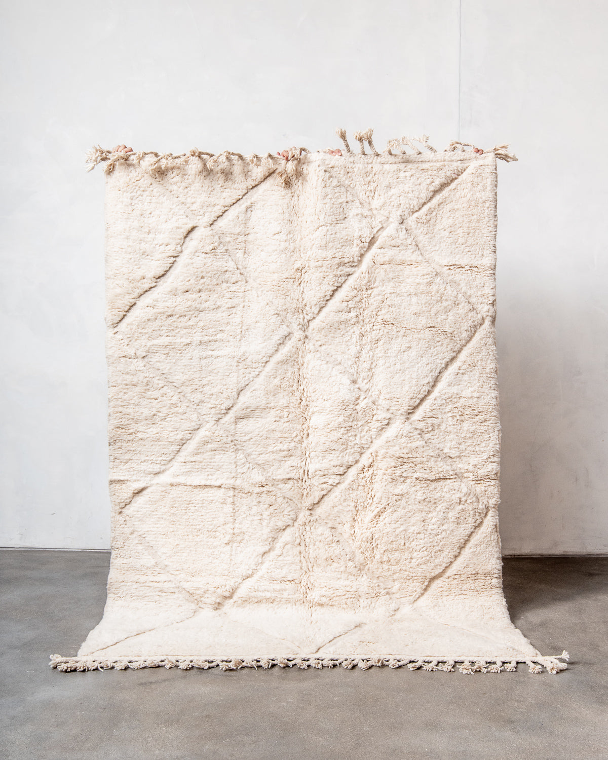 Modern, designer, handcrafted Berber rug from Morocco. Beniourain carpet with minimalist design, natural wool pile and a fluffy texture.