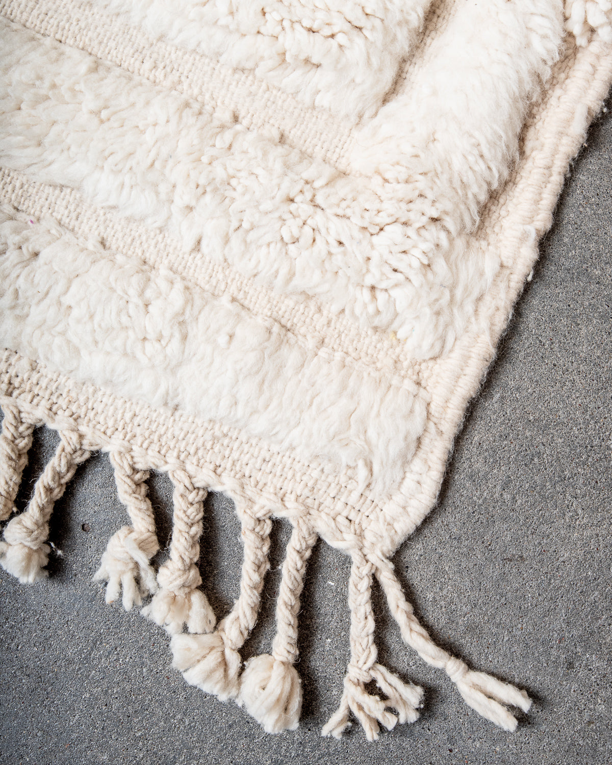 Modern, designer, handcrafted Berber rug from Morocco. Beniourain carpet with minimalist design, natural wool pile and a fluffy texture.