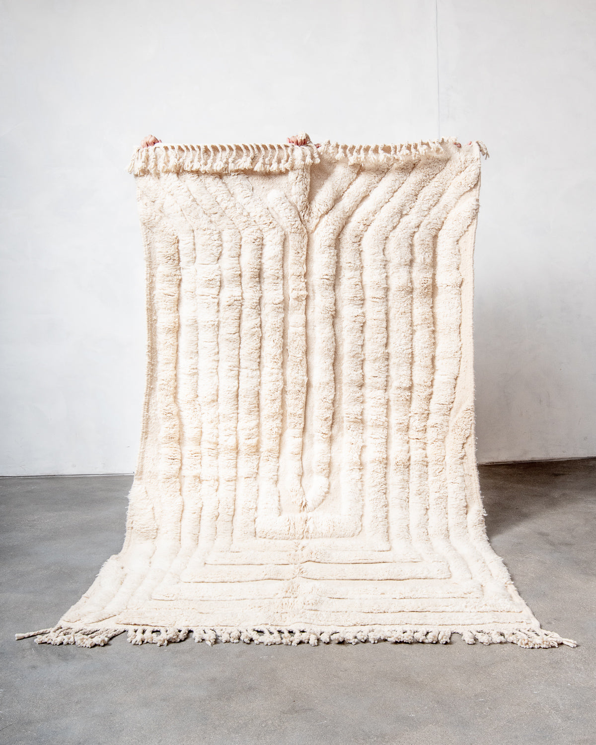 Modern, designer, handcrafted Berber rug from Morocco. Beniourain carpet with minimalist design, natural wool pile and a fluffy texture.