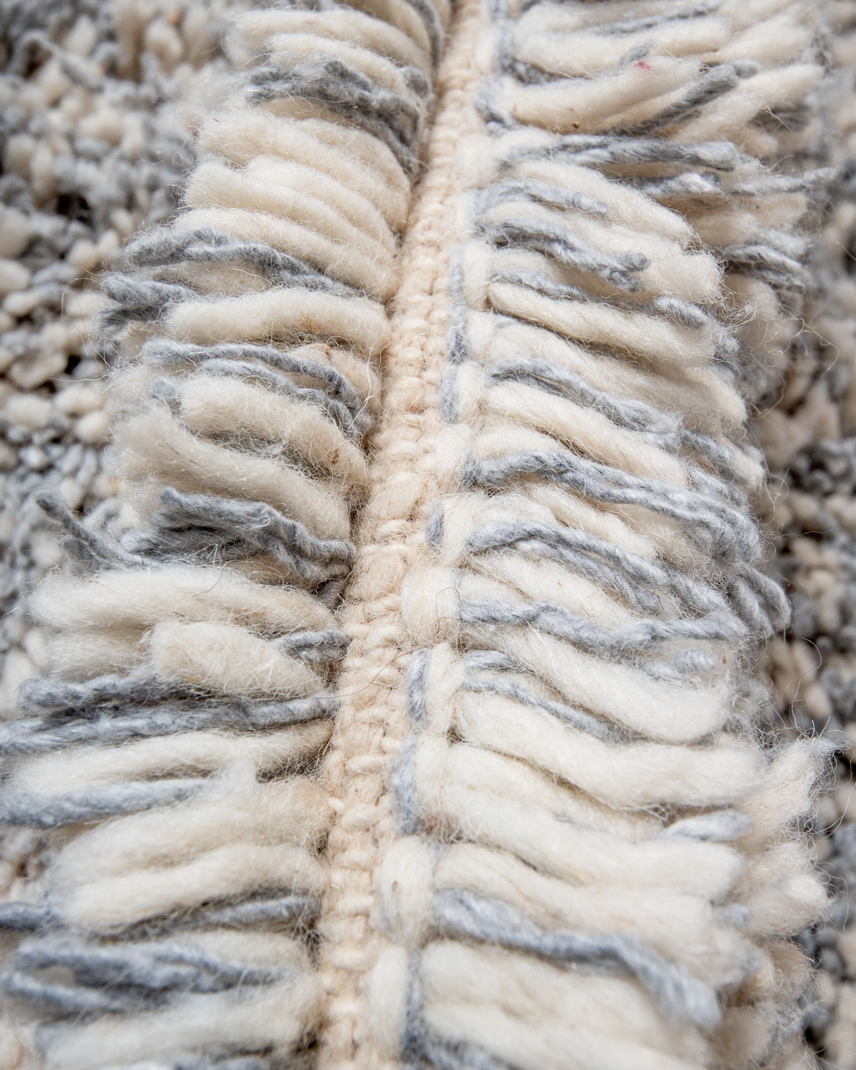 Modern, designer, handcrafted Berber rug from Morocco. Beniourain carpet with minimalist design, natural wool pile and a fluffy texture.