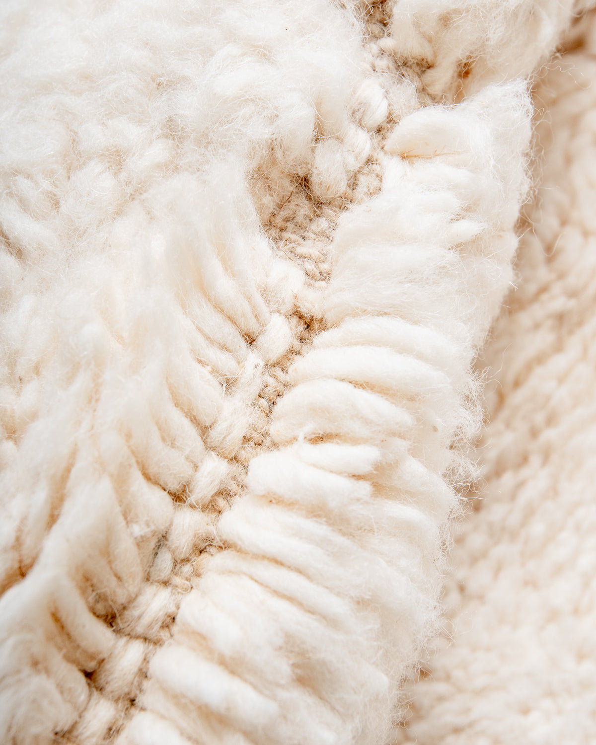 Modern, designer, handcrafted Berber rug from Morocco. Beniourain carpet with minimalist design, natural wool pile and a fluffy texture.