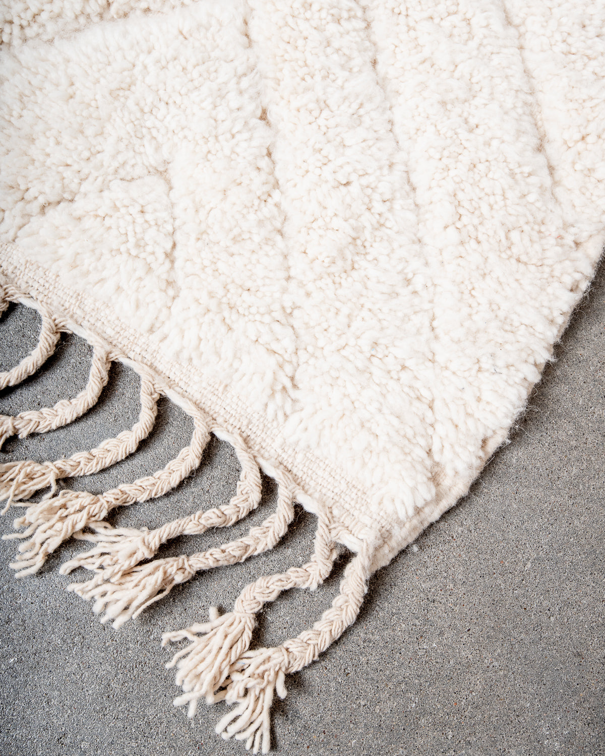 Modern, designer, handcrafted Berber rug from Morocco. Beniourain carpet with minimalist design, natural wool pile and a fluffy texture.