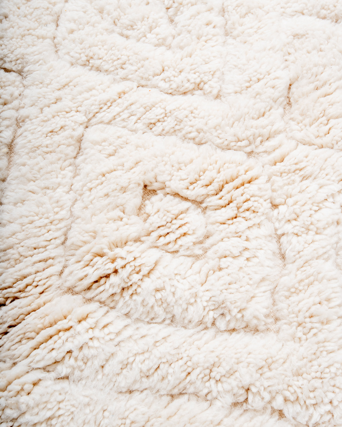 Modern, designer, handcrafted Berber rug from Morocco. Beniourain carpet with minimalist design, natural wool pile and a fluffy texture.