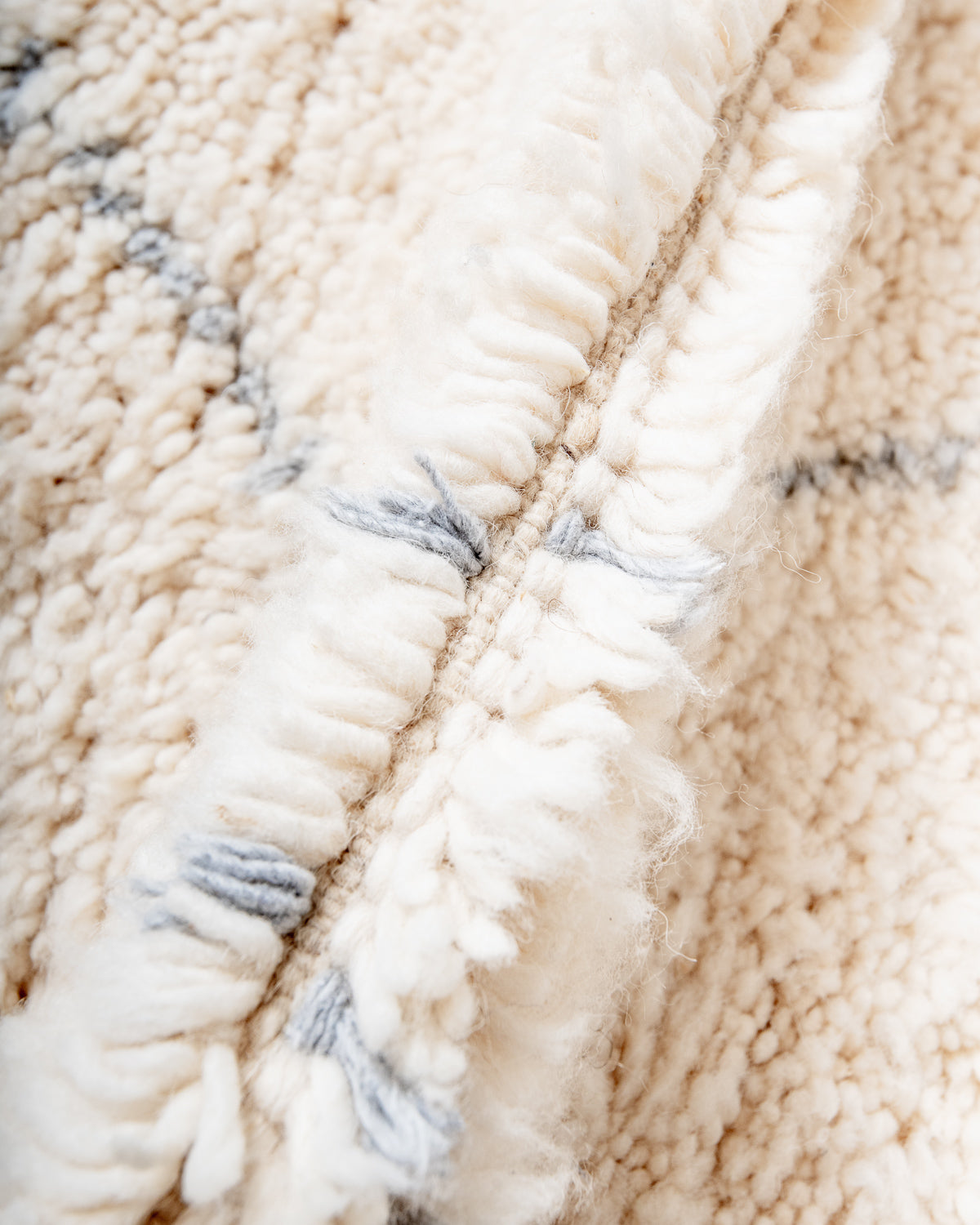 Modern, designer, handcrafted Berber rug from Morocco. Beniourain carpet with minimalist design, natural wool pile and a fluffy texture.