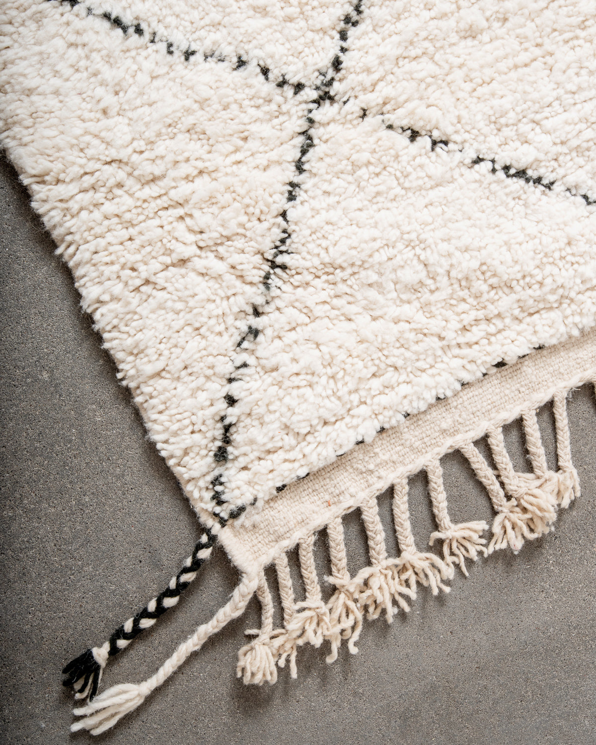 Modern, designer, handcrafted Berber rug from Morocco. Beniourain carpet with minimalist design, natural wool pile and a fluffy texture.
