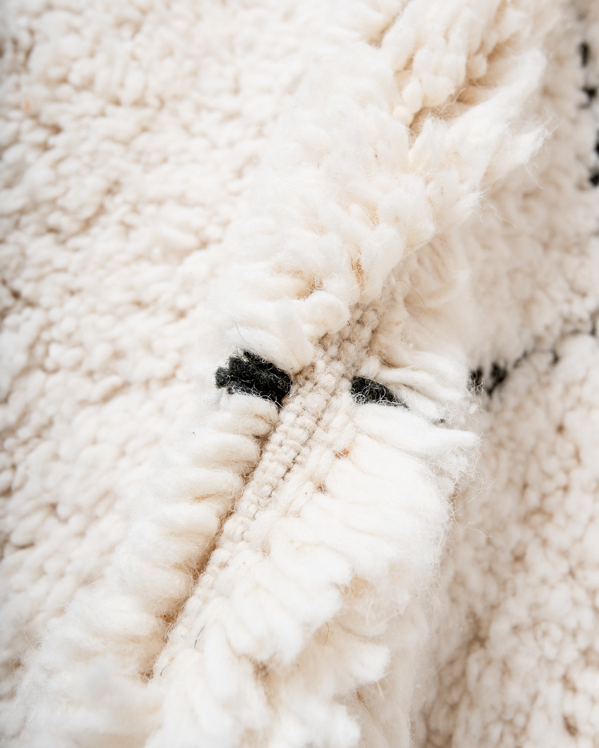 Modern, designer, handcrafted Berber rug from Morocco. Beniourain carpet with minimalist design, natural wool pile and a fluffy texture.