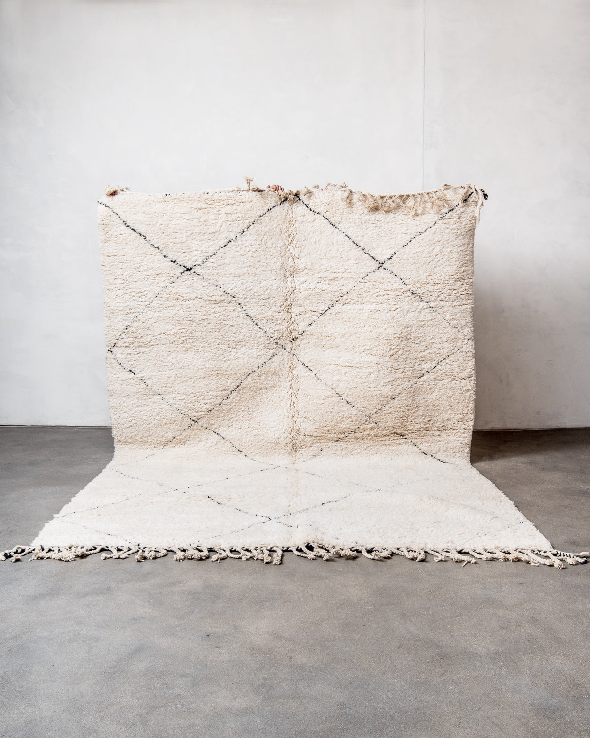 Modern, designer, handcrafted Berber rug from Morocco. Beniourain carpet with minimalist design, natural wool pile and a fluffy texture.