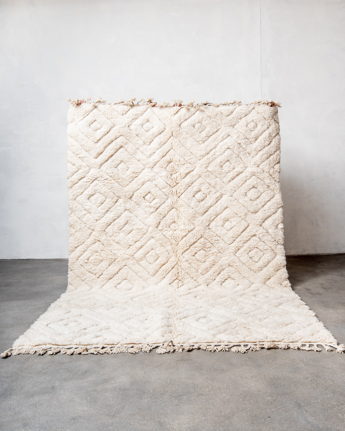 Modern, designer, handcrafted Berber rug from Morocco. Beniourain carpet with minimalist design, natural wool pile and a fluffy texture.