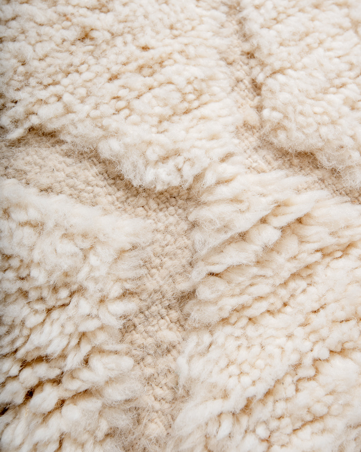 Modern, designer, handcrafted Berber rug from Morocco. Beniourain carpet with minimalist design, natural wool pile and a fluffy texture.