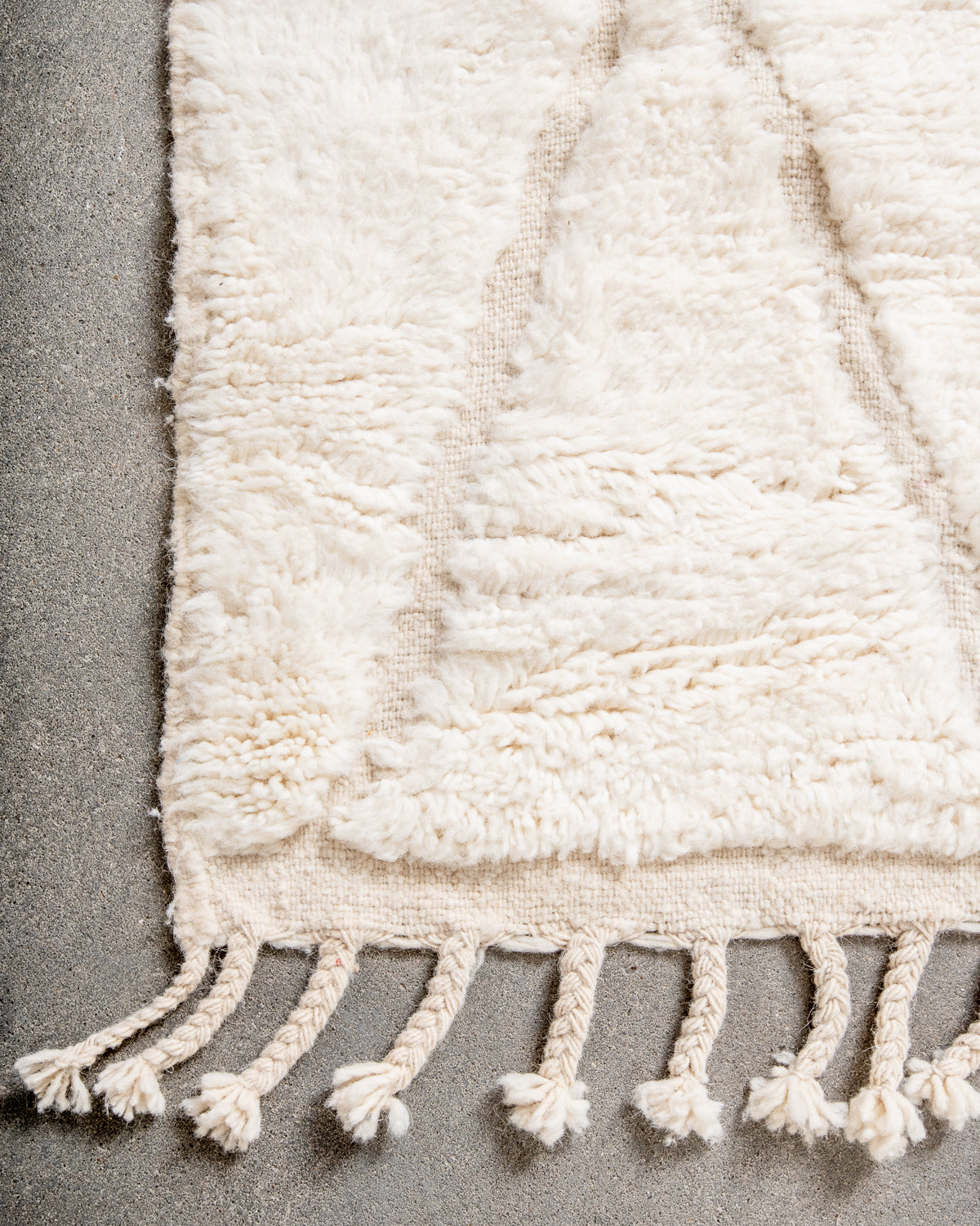 Modern, designer, handcrafted Berber rug from Morocco. Beniourain carpet with minimalist design, natural wool pile and a fluffy texture.