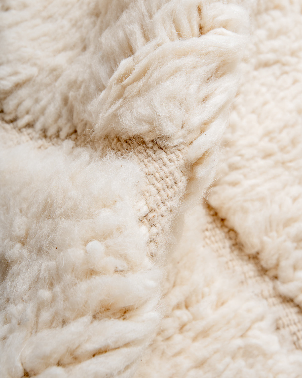 Modern, designer, handcrafted Berber rug from Morocco. Beniourain carpet with minimalist design, natural wool pile and a fluffy texture.