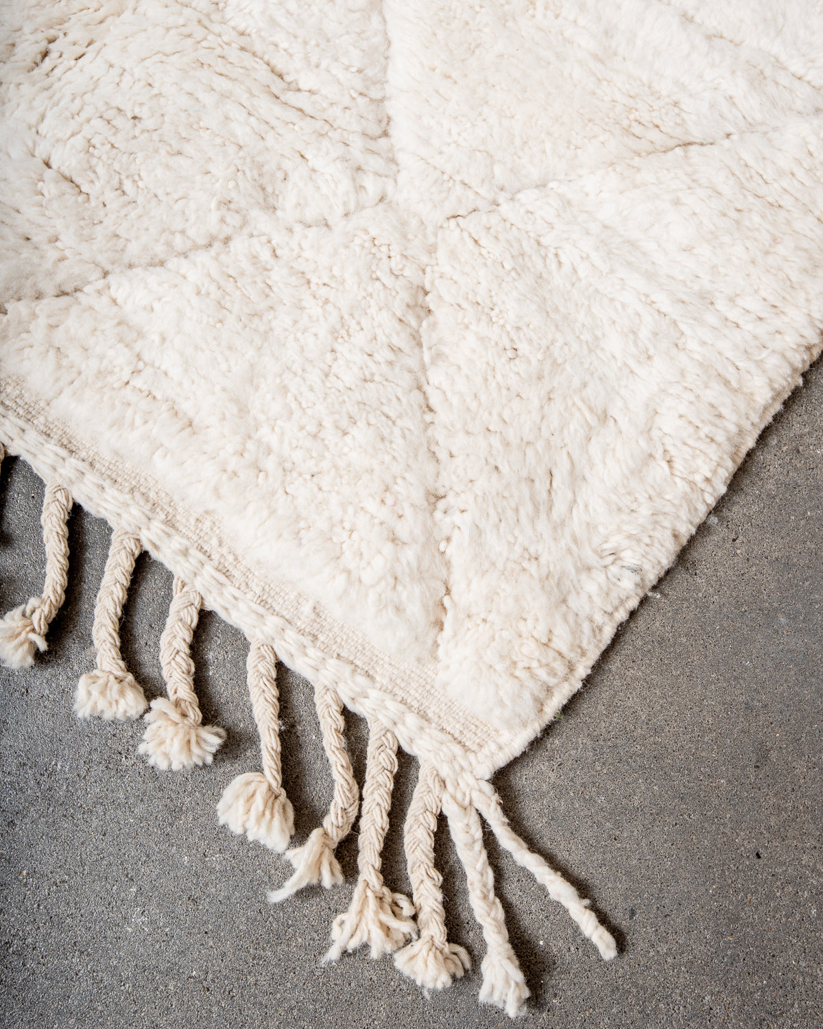 Modern, designer, handcrafted Berber rug from Morocco. Beniourain carpet with minimalist design, natural wool pile and a fluffy texture.